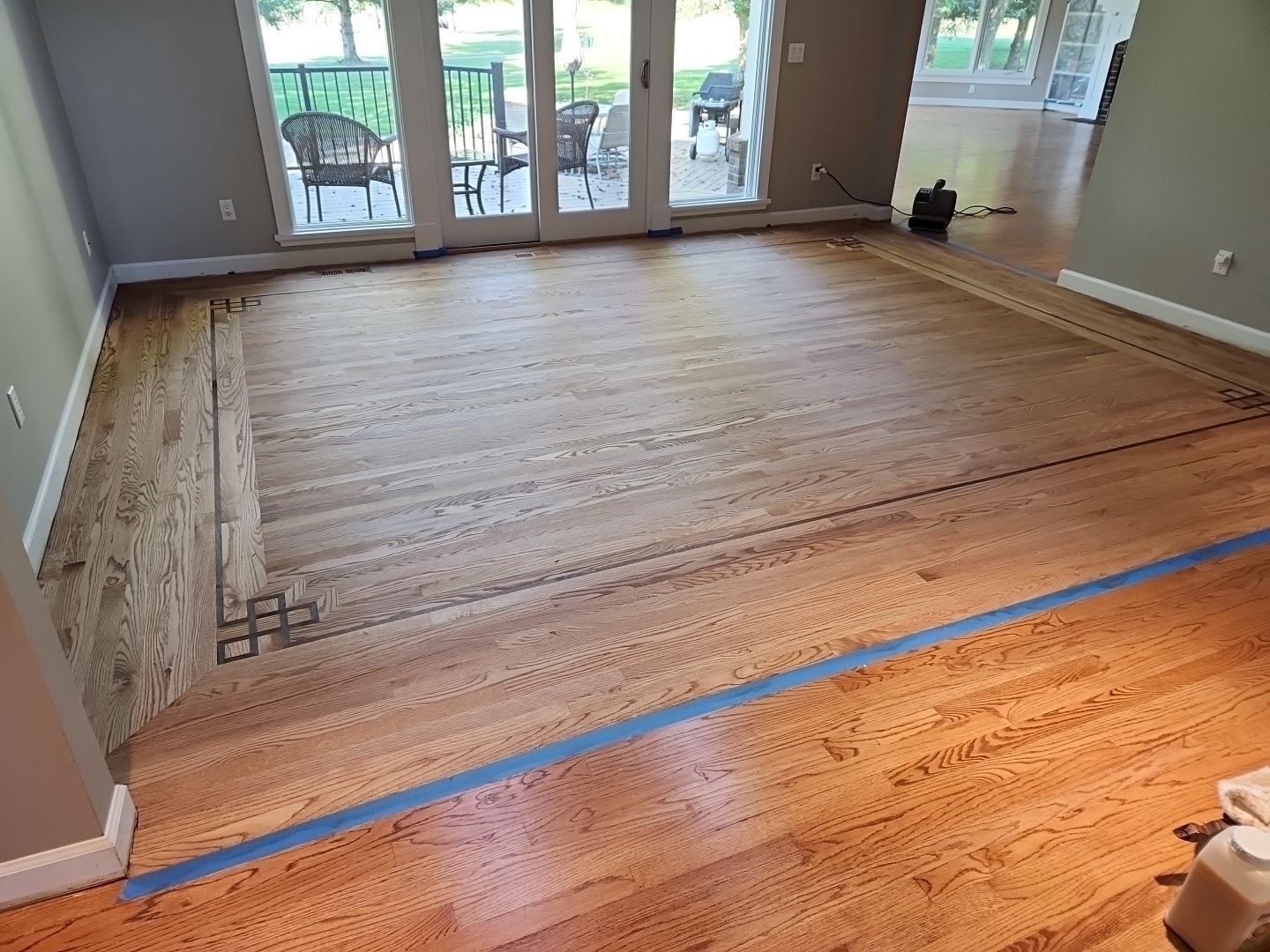 Ann Arbor Elegance: Red Oak and Walnut Living Room Masterpiece by Ann Arbor Hardwoods