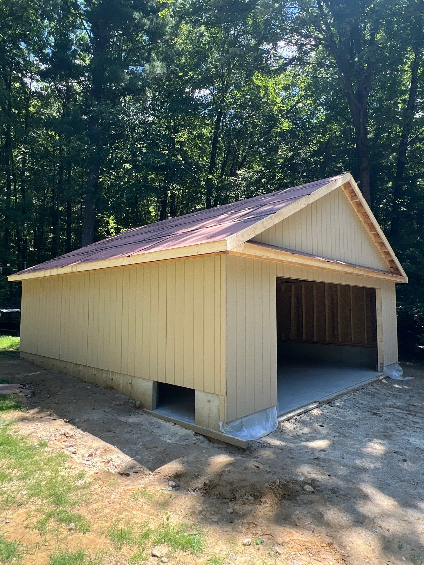 Garage using LP SmartSide Panel Siding by Chagnon Building & Remodeling LLC