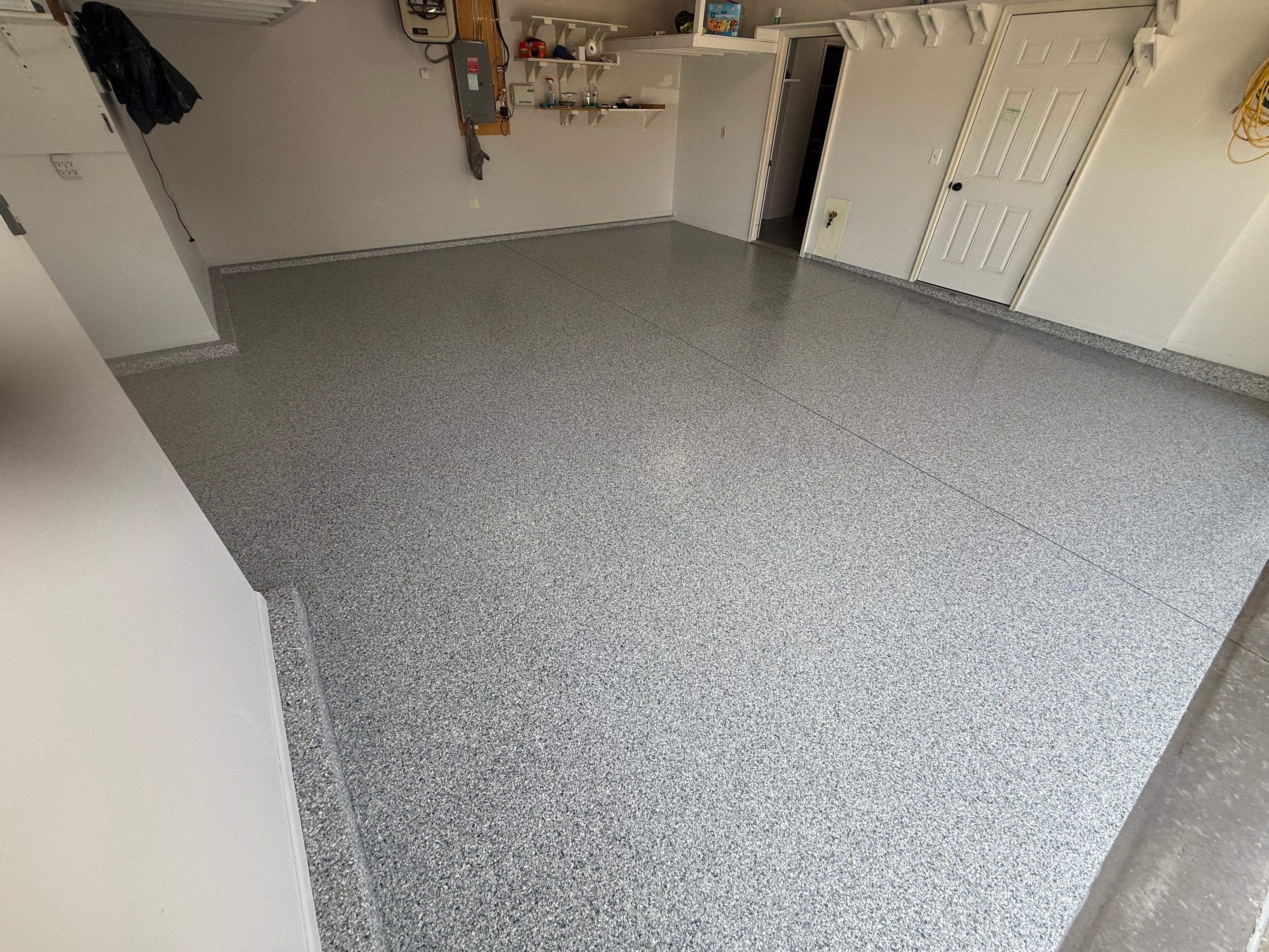 Decorative Chip Epoxy Floor Coating Installation in Sioux Falls by Select Painting, Coatings & Garage Cabinets