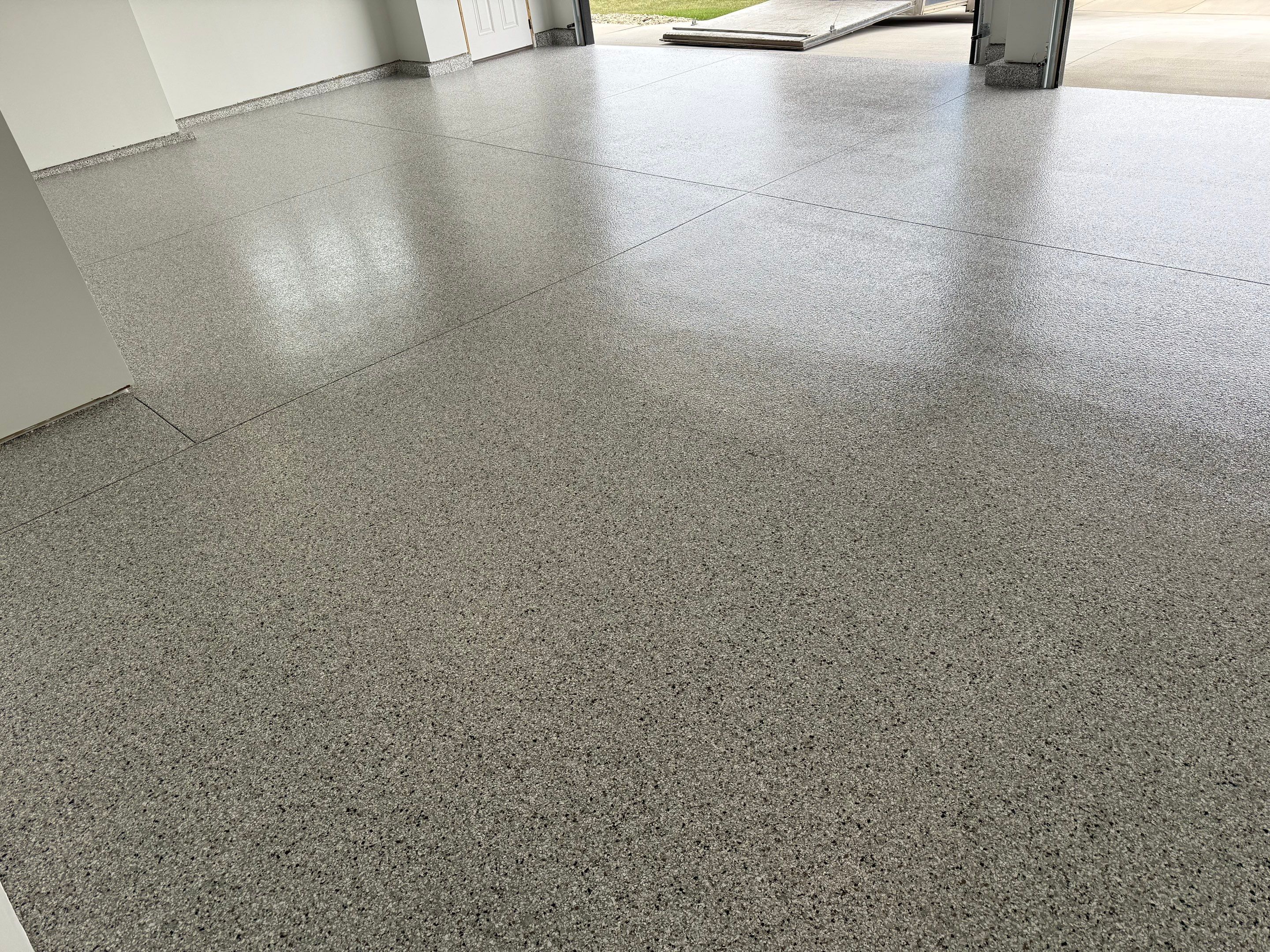 High-Gloss Epoxy Flake Garage Floor Coating in Brandon by Select Painting, Coatings & Garage Cabinets