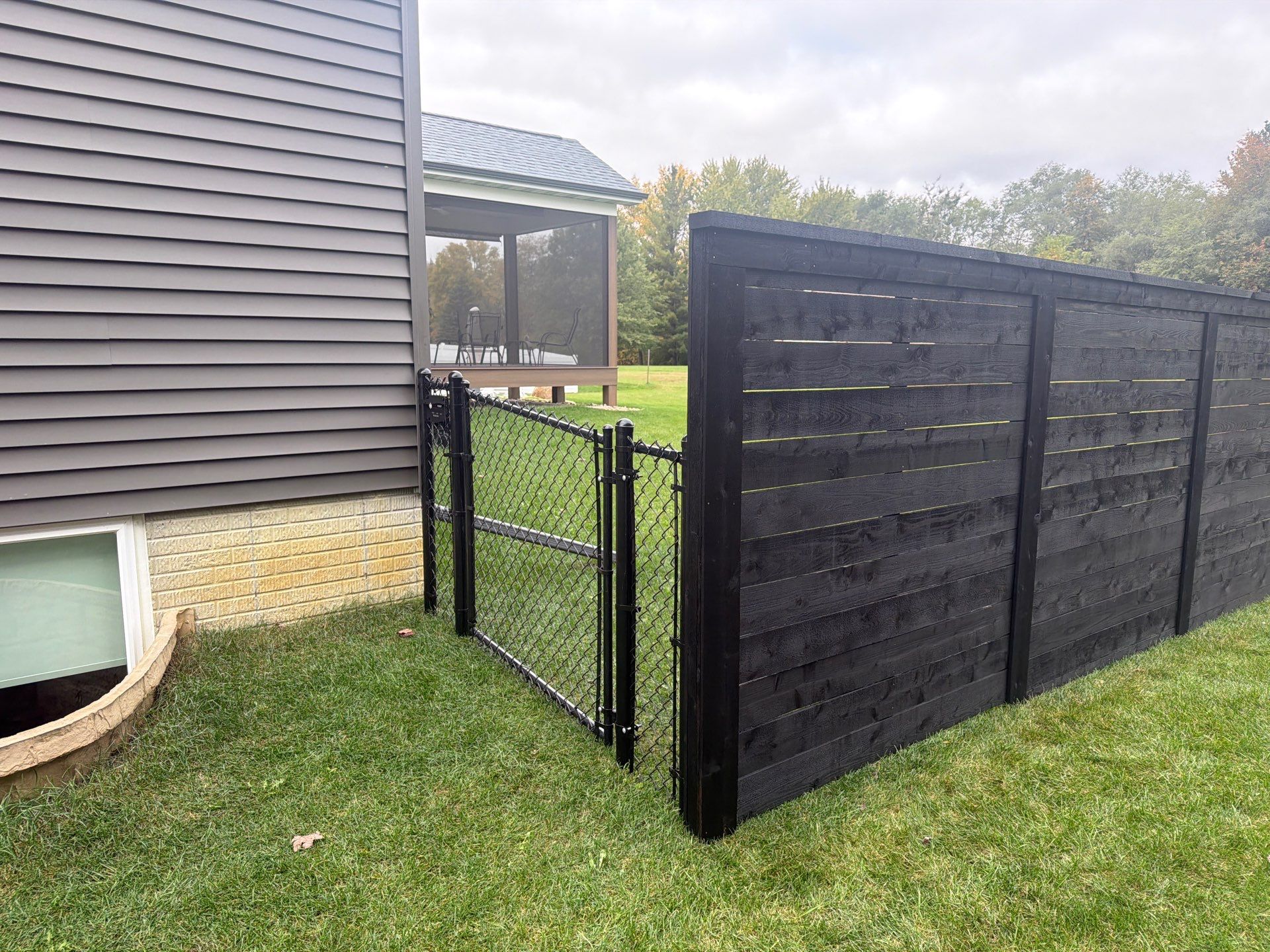 Modern Horizontal Wood Privacy Fence Installation in Cedar Falls by Perfect Picket Fence and Stain