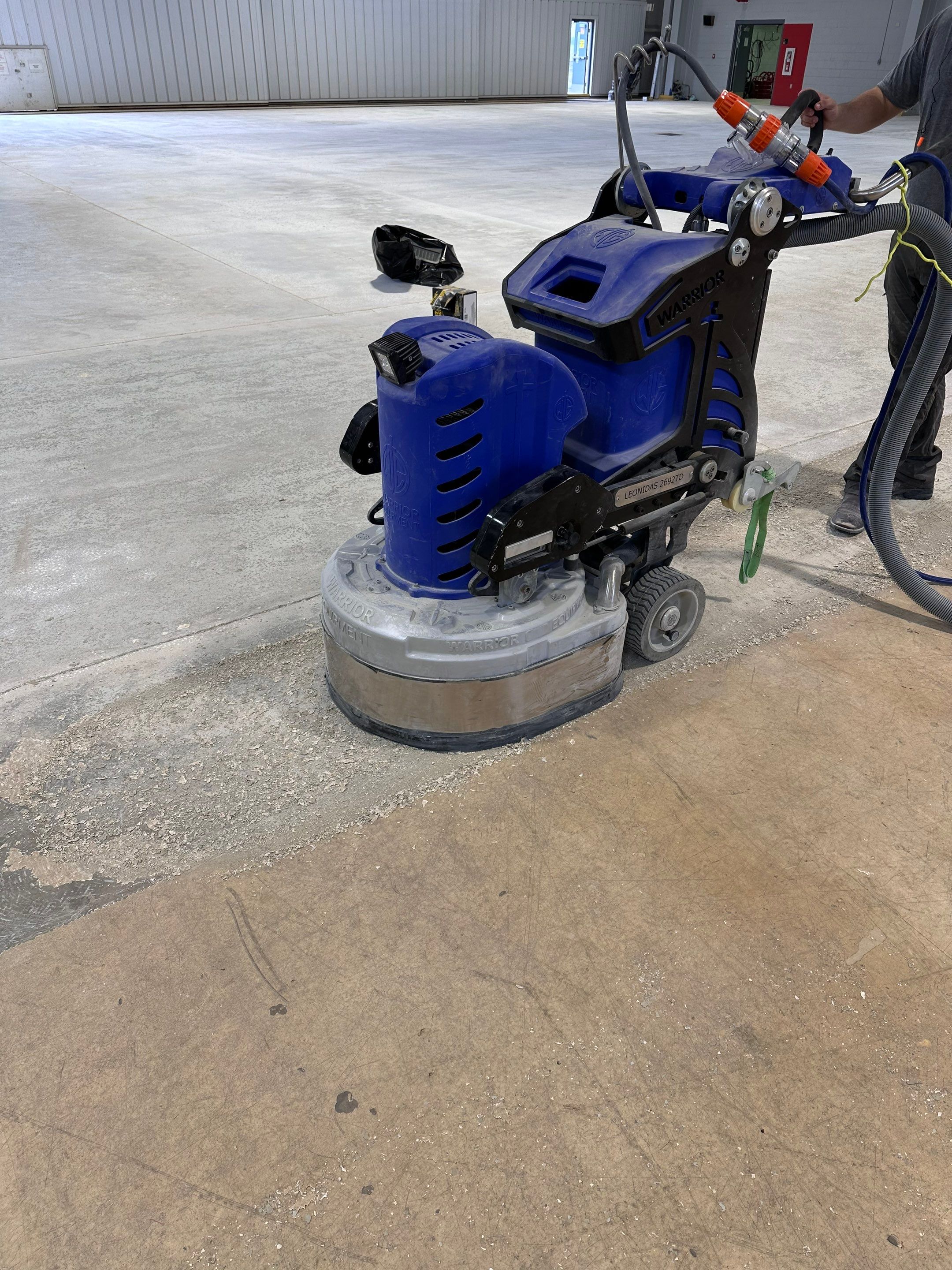 Industrial Epoxy Flooring for Army National Guard Hangar in Mobile by Cornerstone Hard Surface Restoration 