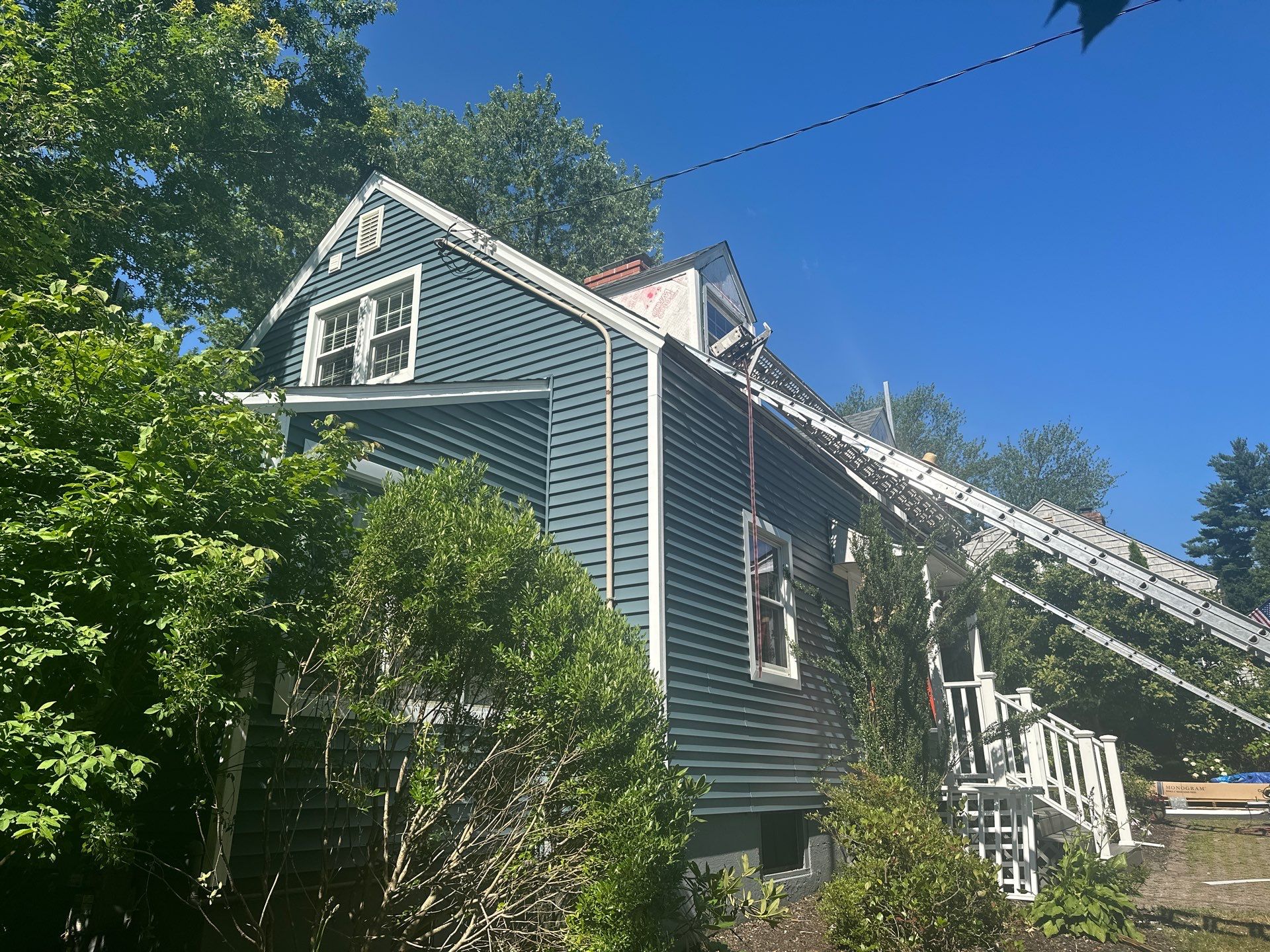 Complete Exterior Estate gray with Pacific Blue Siding by A Plus Exterior