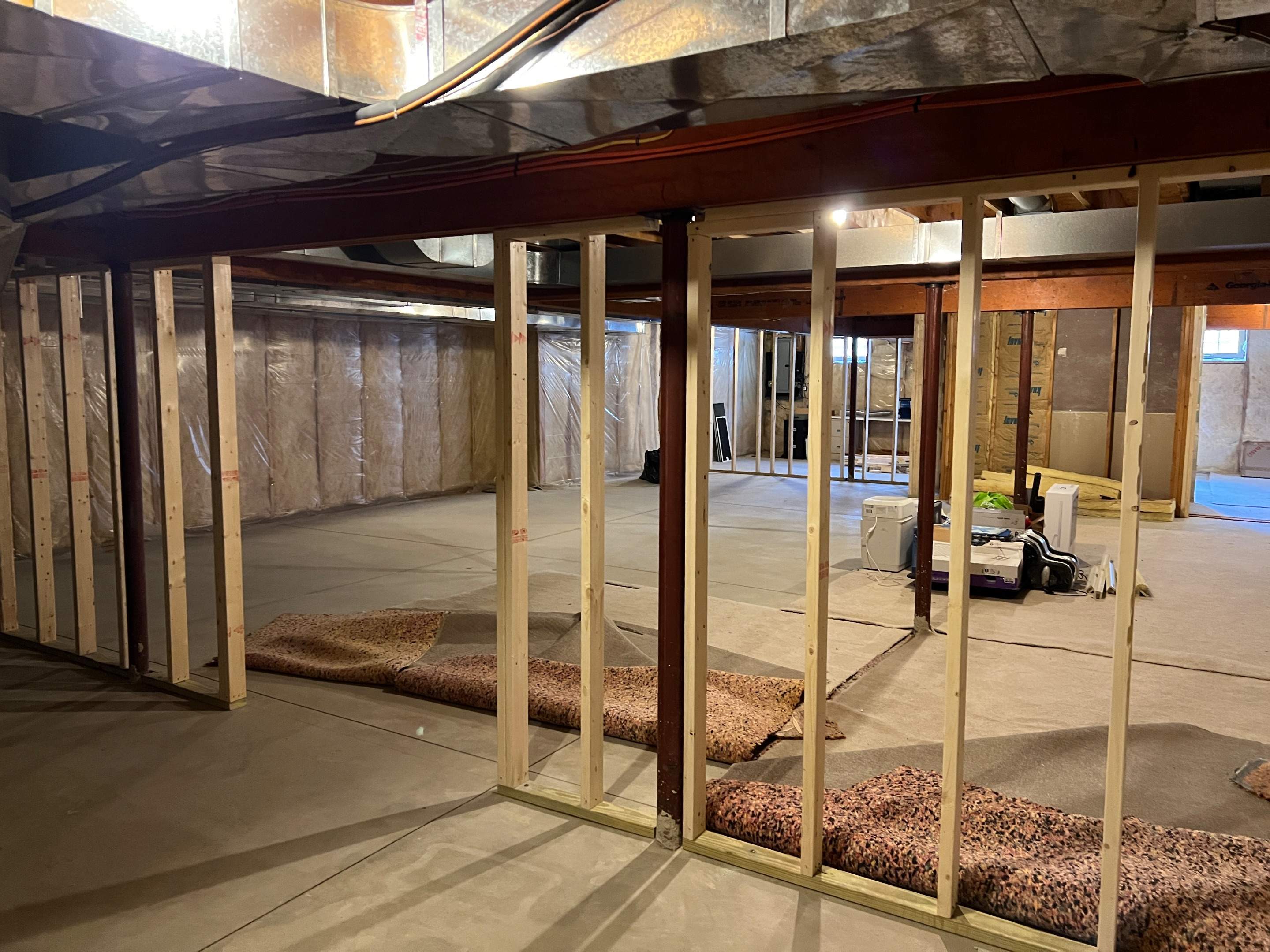 Basement Remodel w/ LVP Flooring & Exposed Ceiling by Chagnon Building & Remodeling LLC