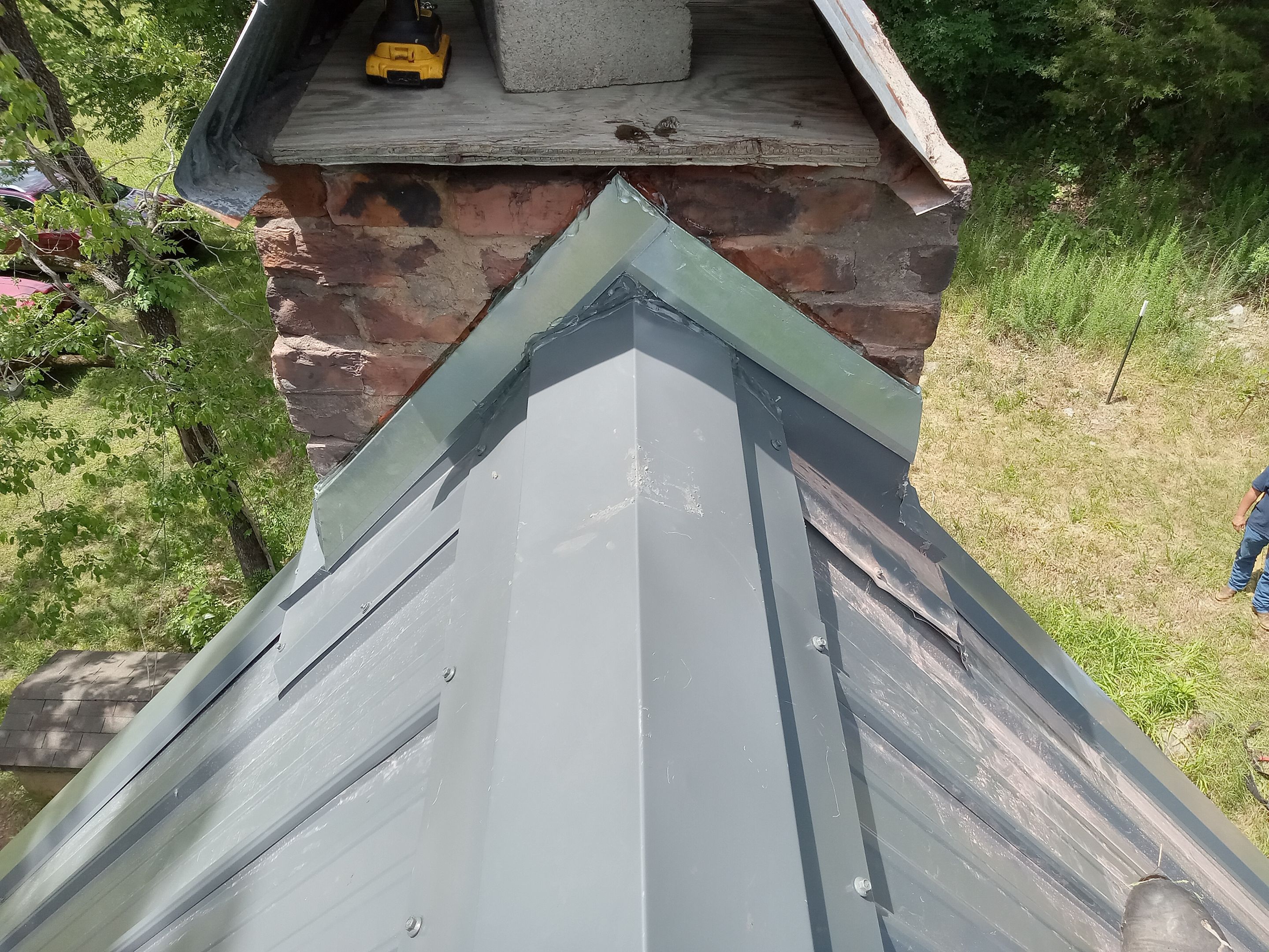 Residential Roofing Installation using 26 Gauge Colored Panels by Hostetler Roofing