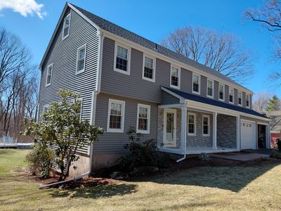 Glastonbury Exterior Renovation with Castle Stone Siding & Stone Entry Upgrade