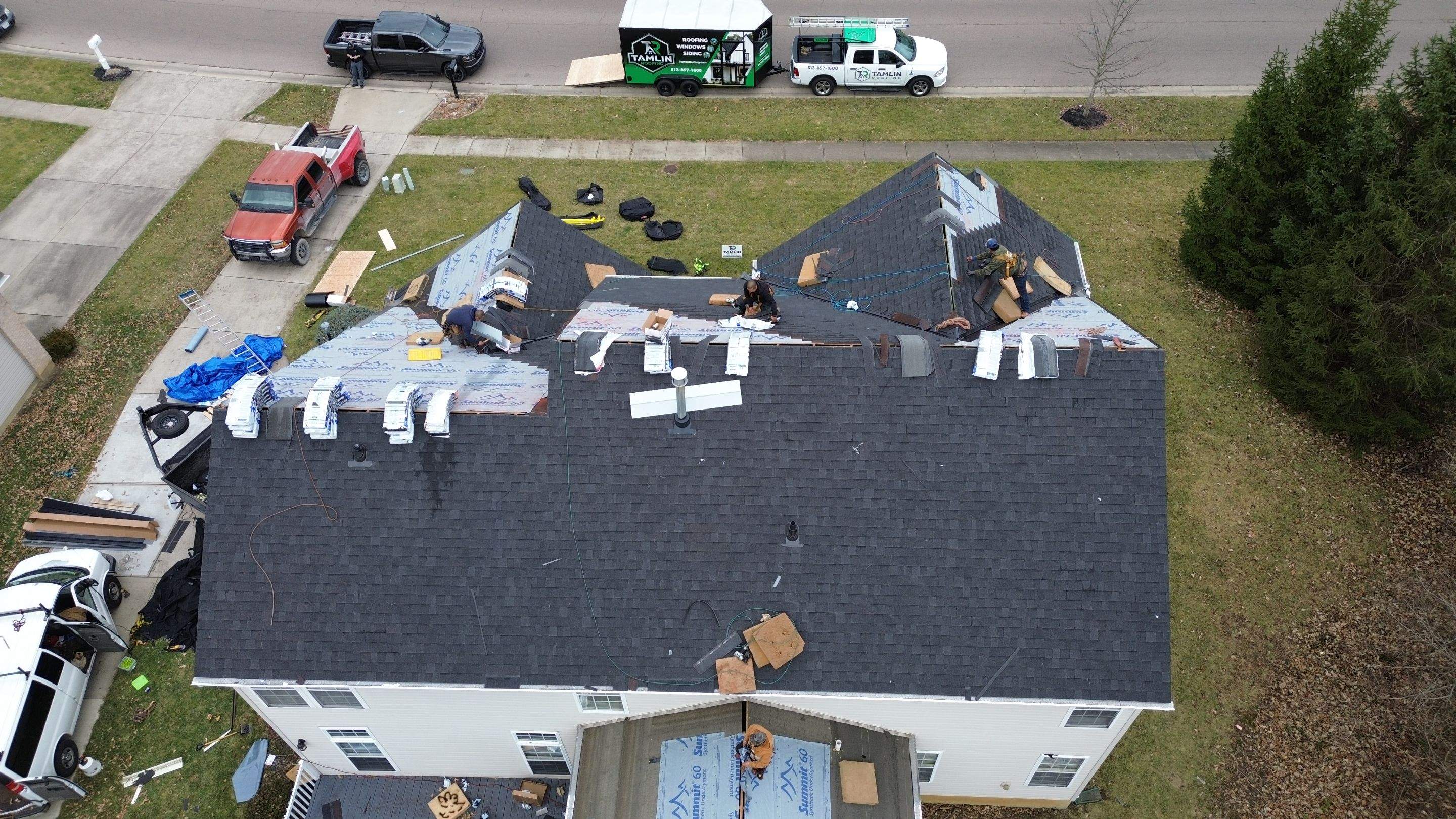 Walden Ponds - Pristine Black and Hydro Flo Gutter Guards by Tamlin Roofing