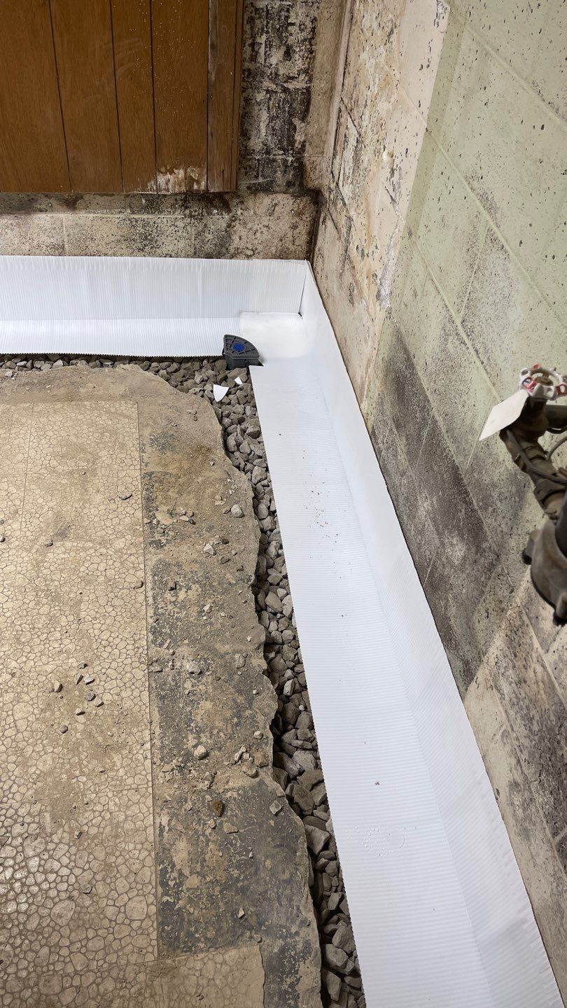 Interior Waterproofing Using GrateDrain™ Products by Toledo Basement Repair