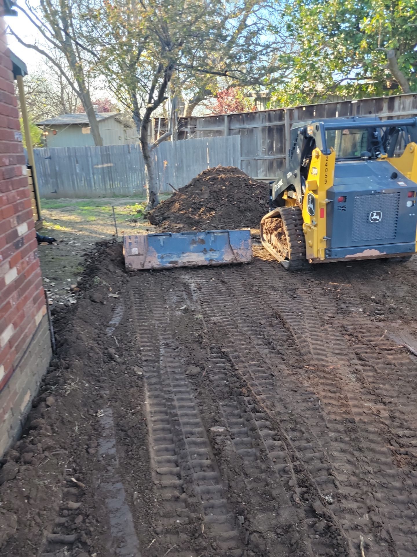 Concrete Driveway and Fence by Clays Services Inc