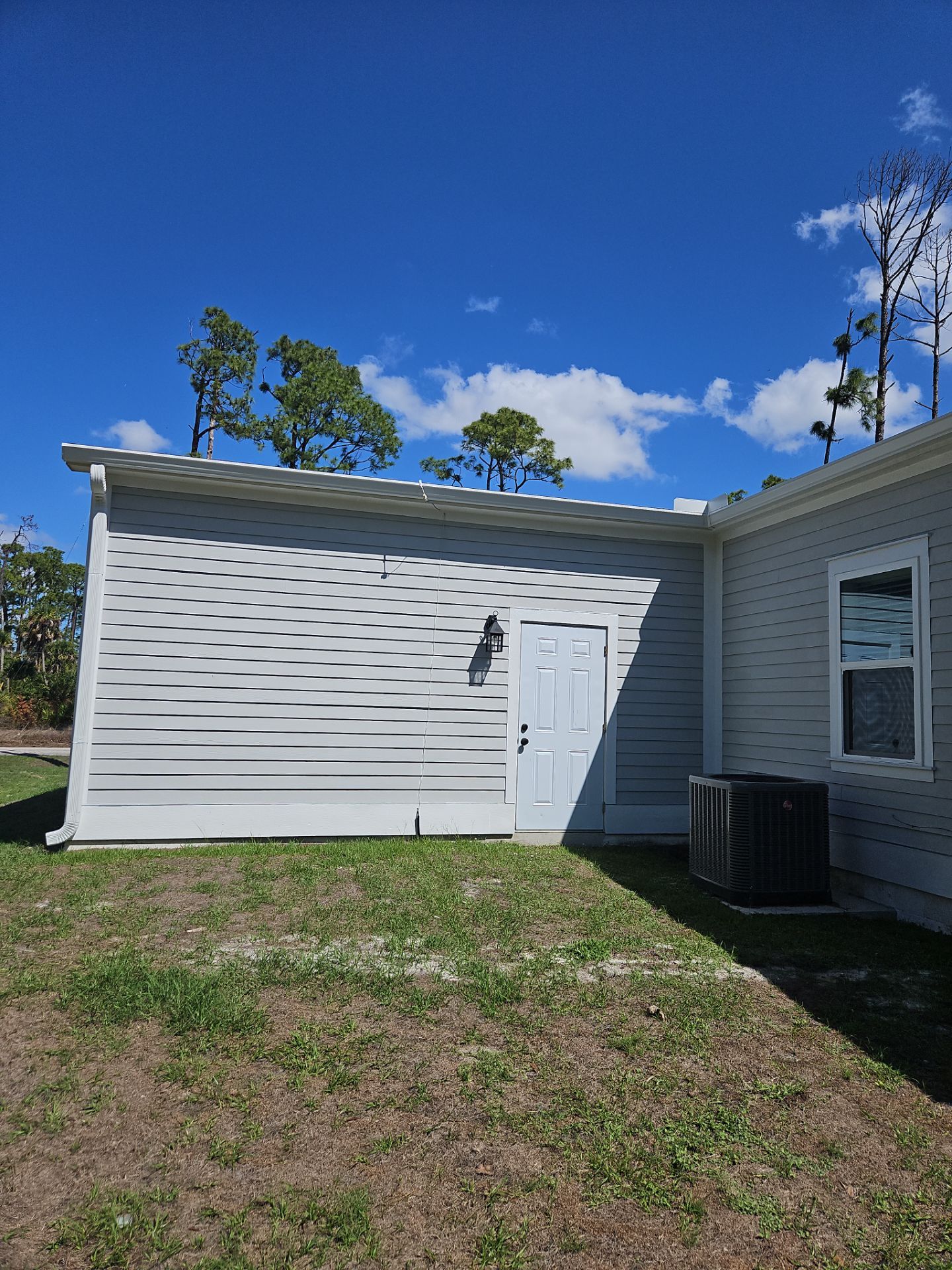 Downspout Installation using 3X4 Elbow Downspout in Port Charlotte FL by Gutter Professors