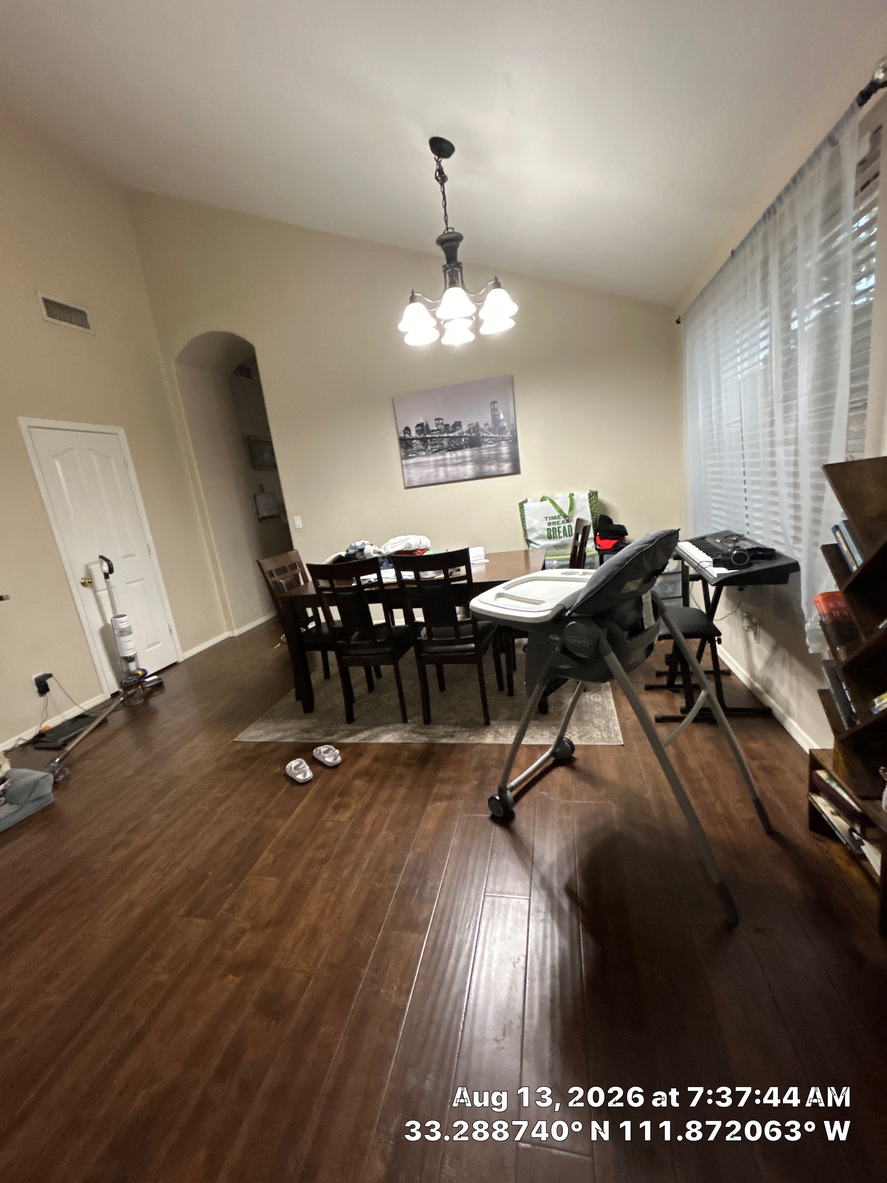 Dark Wood Laminate Flooring Installation in Chandler Dining Room by CompanyCam Sales Demo