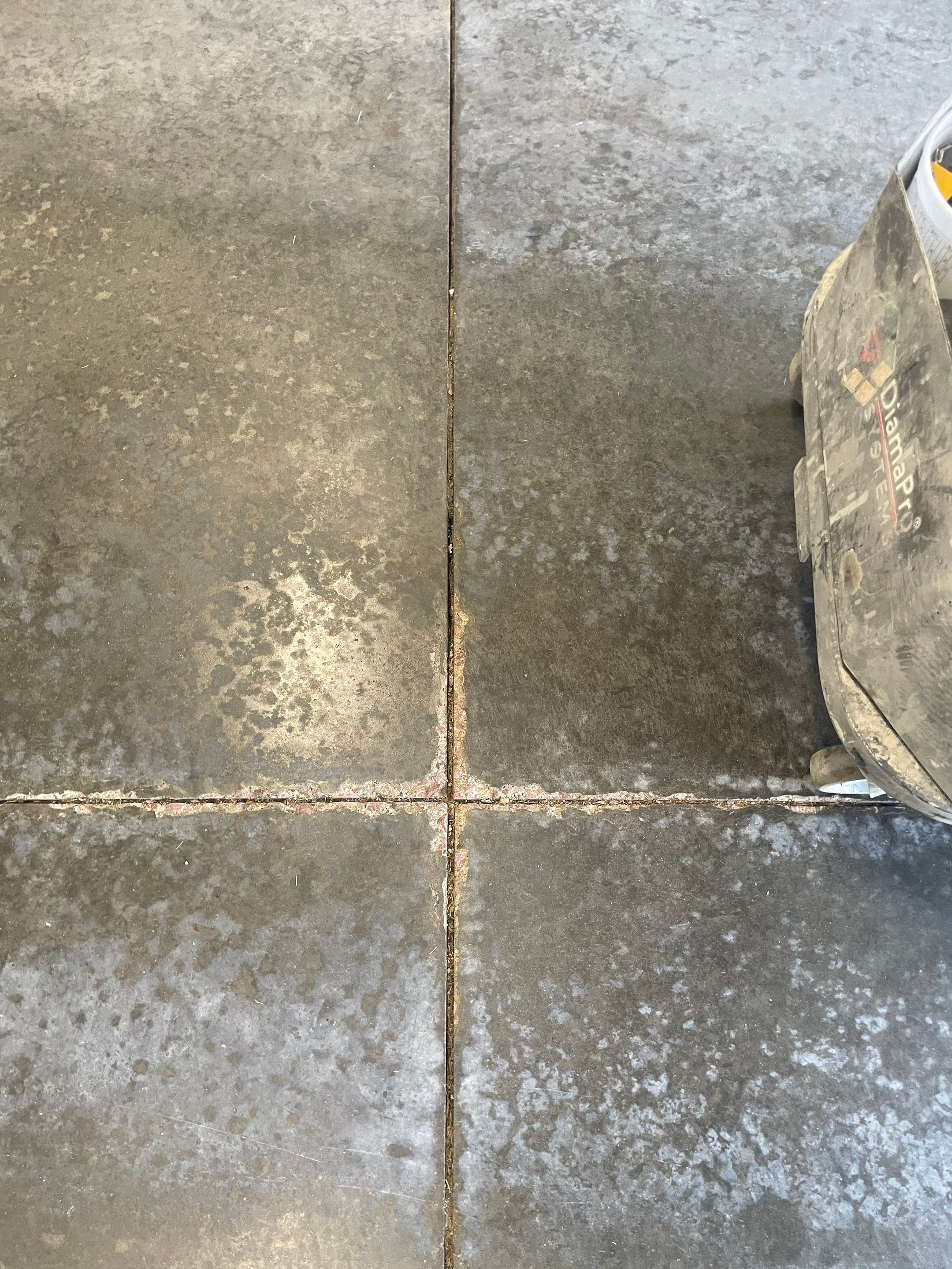 Multi-Stall Garage Floor Coating Installation in Sioux Falls by Select Painting, Coatings & Garage Cabinets