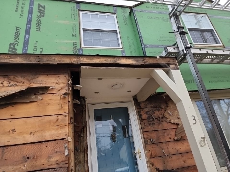 James Hardie siding, new metal roof and couple windows being installed. by UBrothers Construction