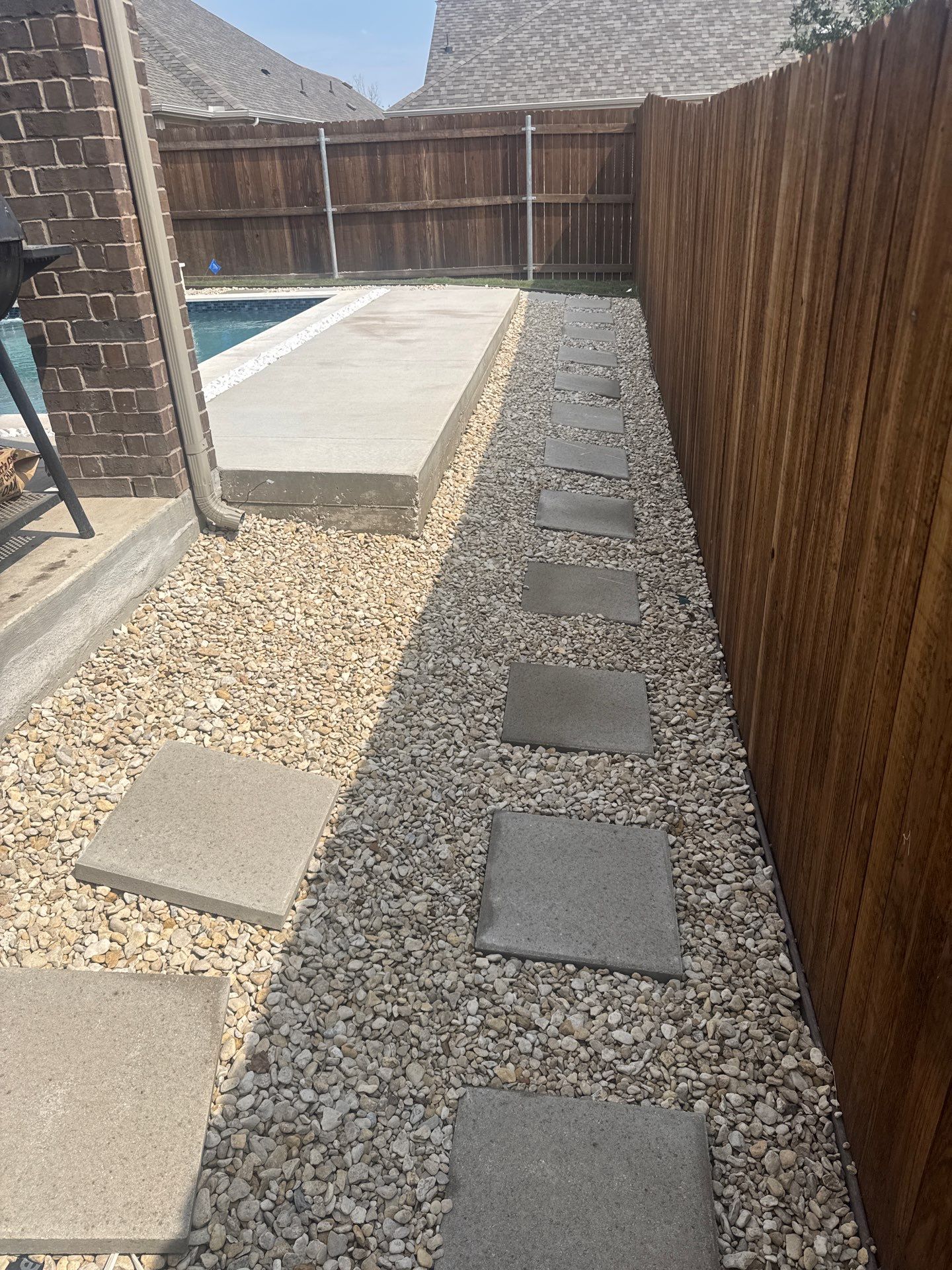 Sleek Geometric Pool with Tanning Ledge and Turf by Pinnacle Pools and Spas - DFW