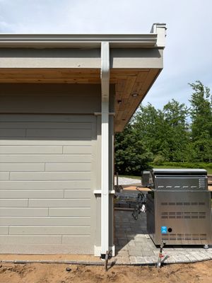 White Gutter and Downspout Installation for a Petoskey Home