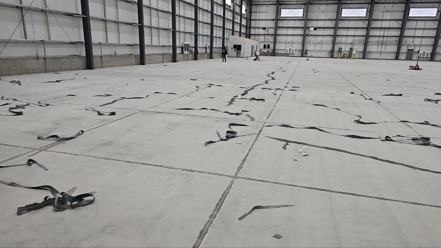 Airplane Hanger using Light Grey Commercial Penntek Epoxy by Croc Coatings, LLC