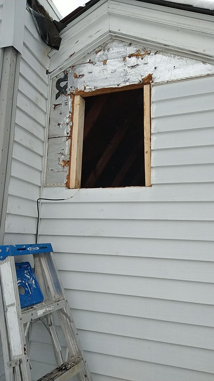 James Hardie Siding  using James Hardie Board and Batten, White by Absolute Roofing and Construction