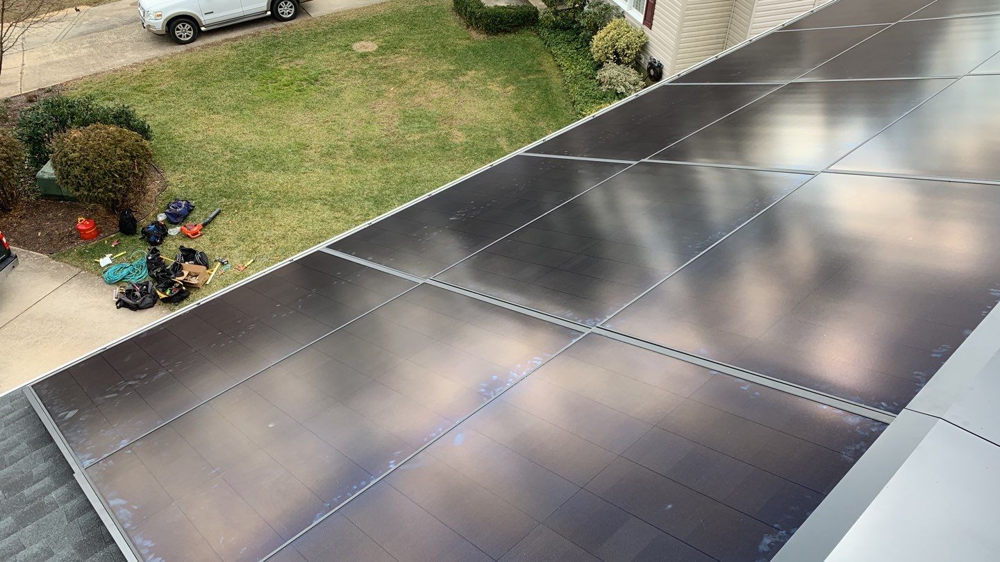 Roof Replacement with GAF Decotech integrated solar panels by American Home Contractors