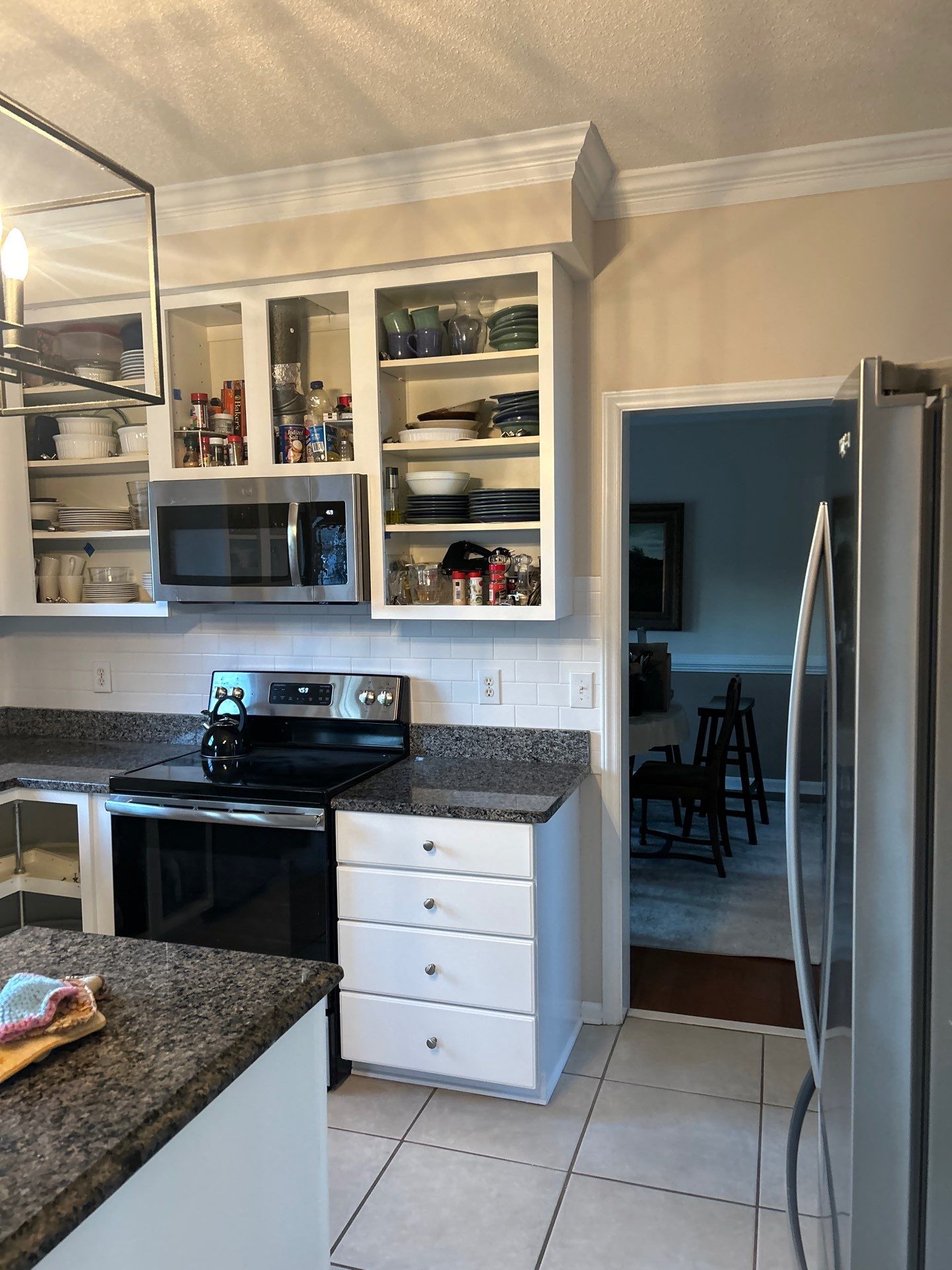 Cabinet painting by GonzalezPainters & Contractors Inc 
