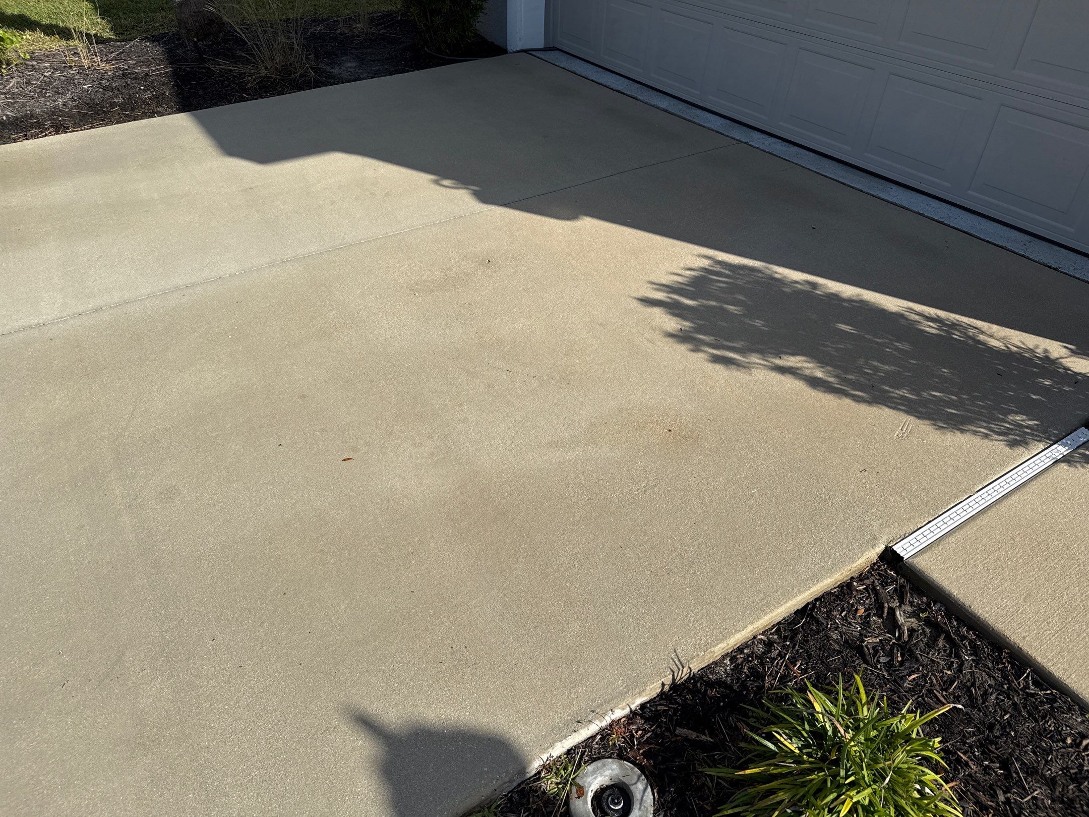 Oil Stain Removal & Concrete Cleaning – The Heights Community, Bradenton, FL by Sunshine AquaWash