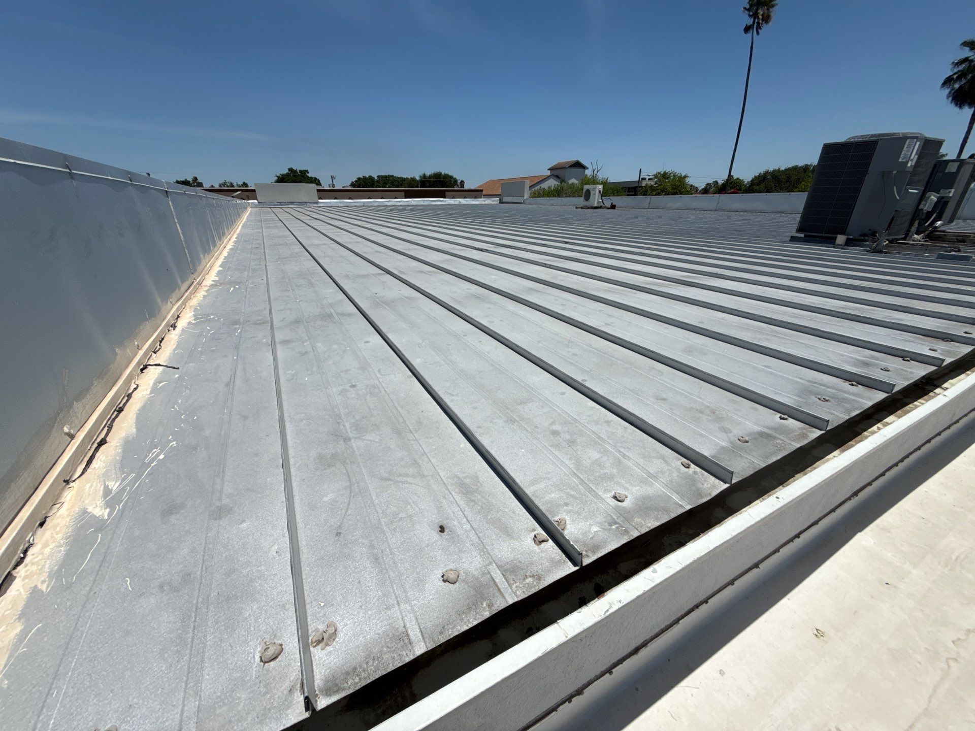 Standing seam metal roof leak repair completed by Frontline Roofing in McAllen, TX