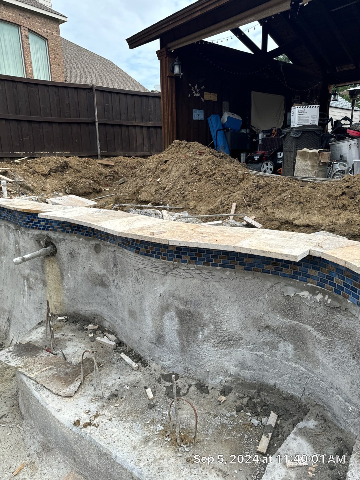 Freeform Pool and Spa with Raised Stone Water Wall by Pinnacle Pools and Spas - DFW