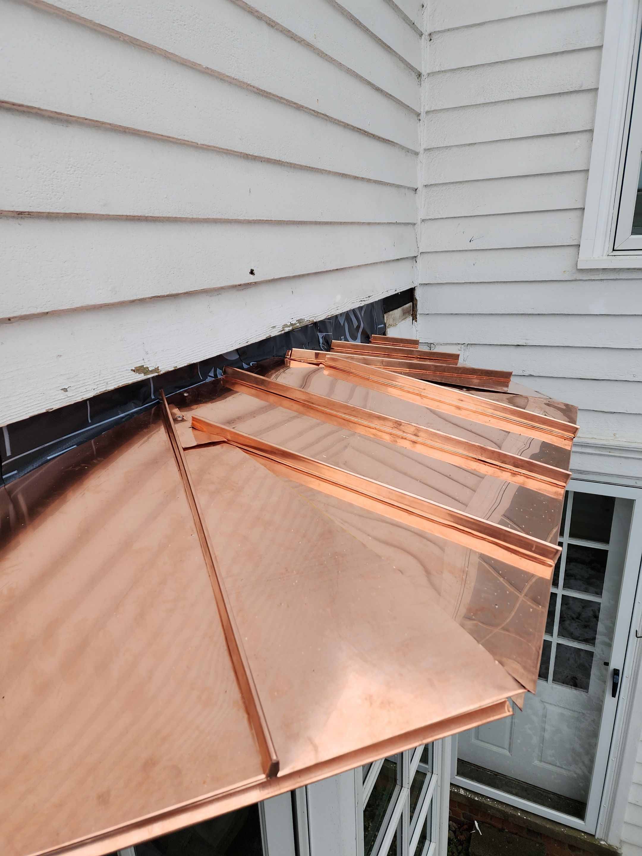Copper Roof using Copper by Absolute Roofing and Construction