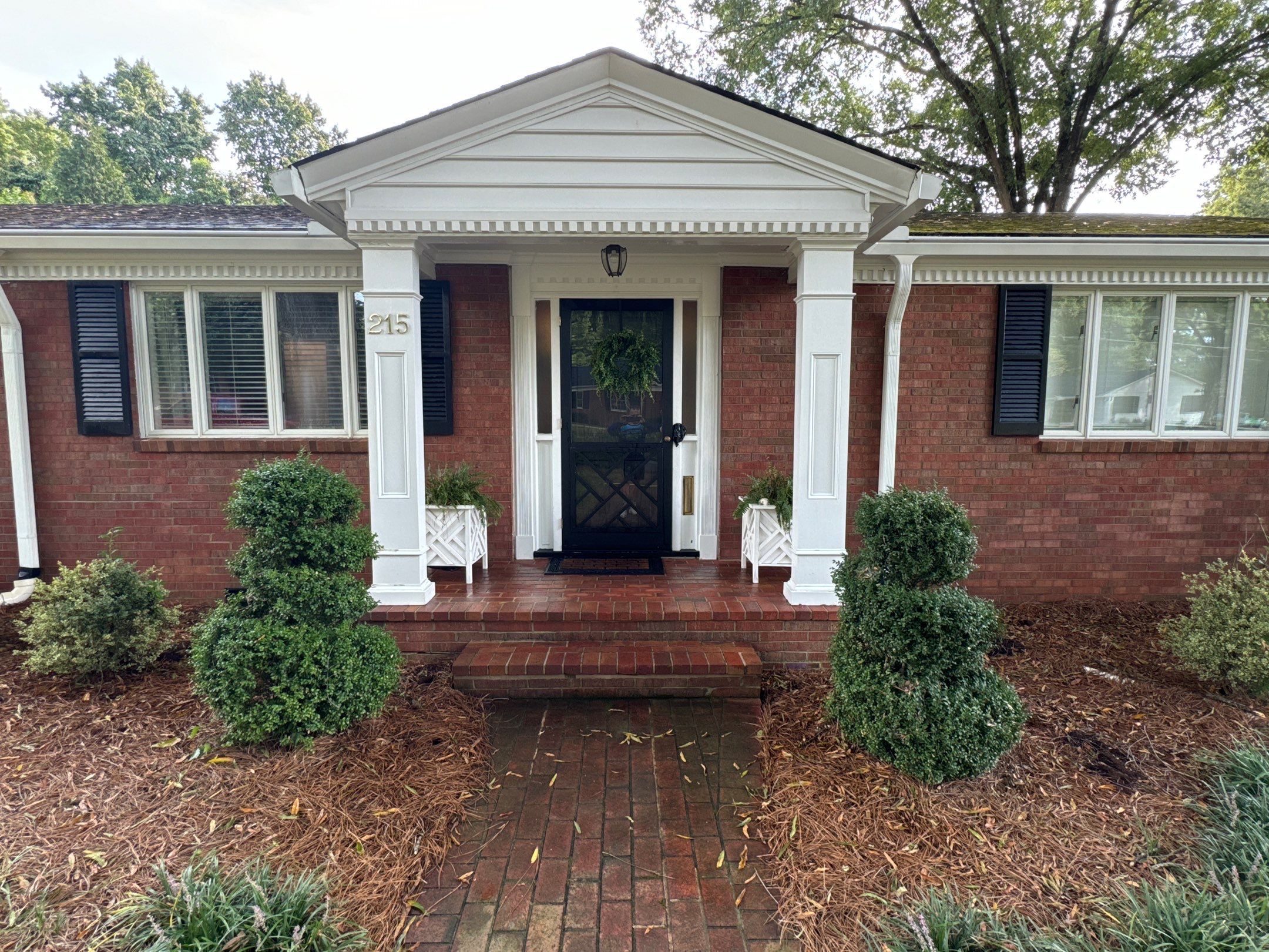 the service is cleaning the brick walkway and front porch area removing dirt and grime for better appearance and maintenance