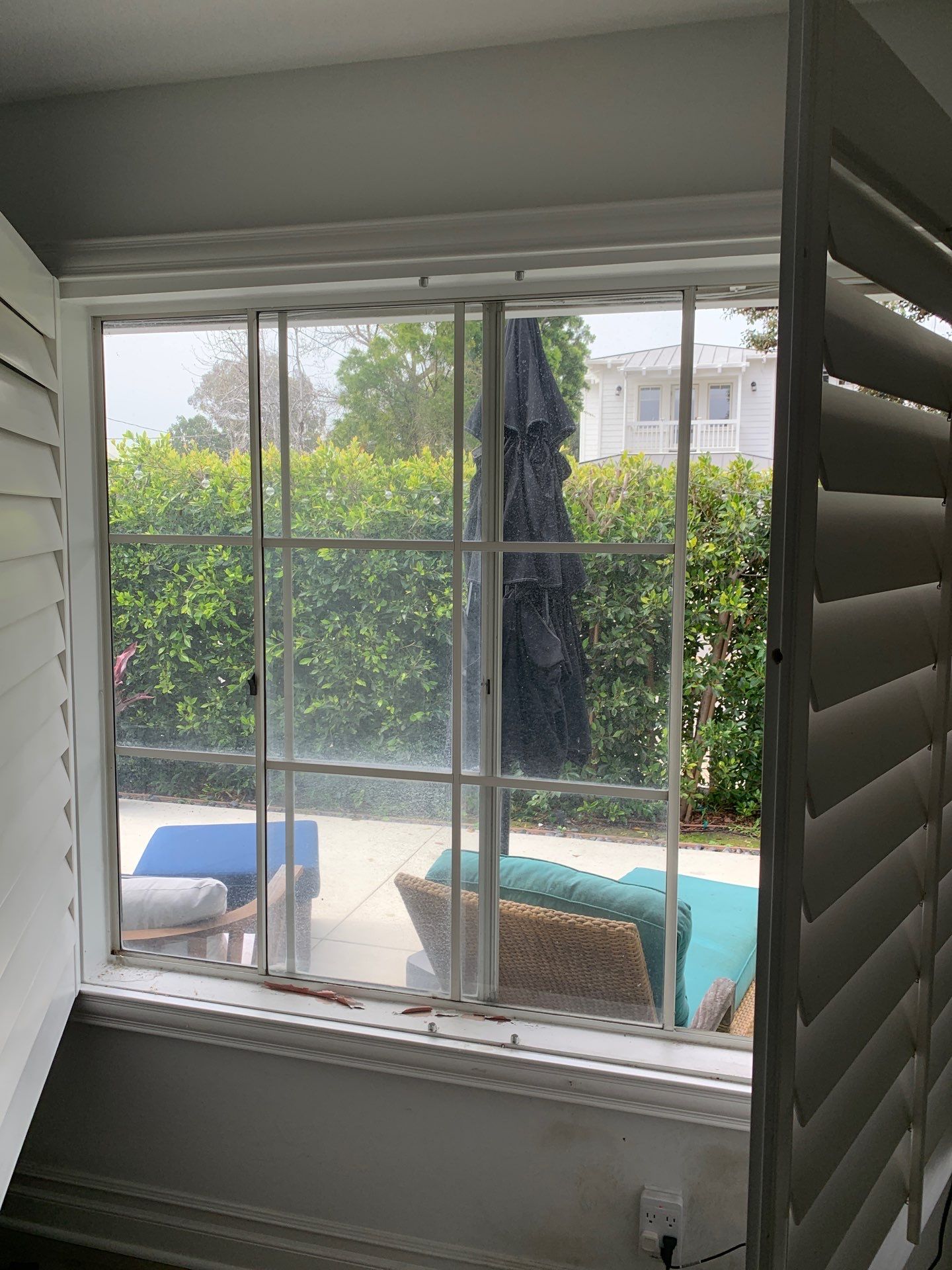 Window Installation using Milgard black vinyl windows by American Window Company