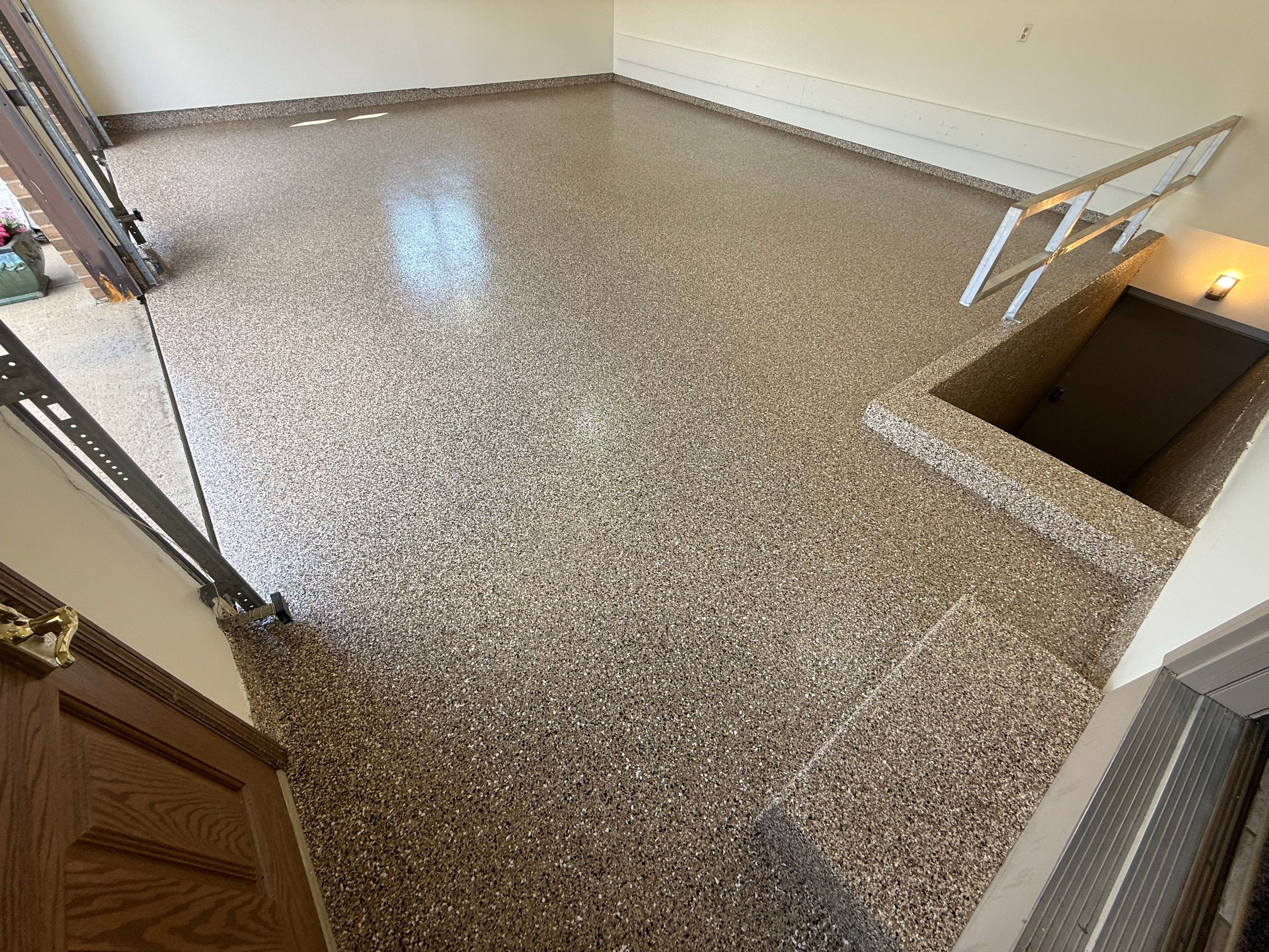 Custom Polyaspartic Garage Floor and Stairwell Coating in Pipestone by Select Painting, Coatings & Garage Cabinets