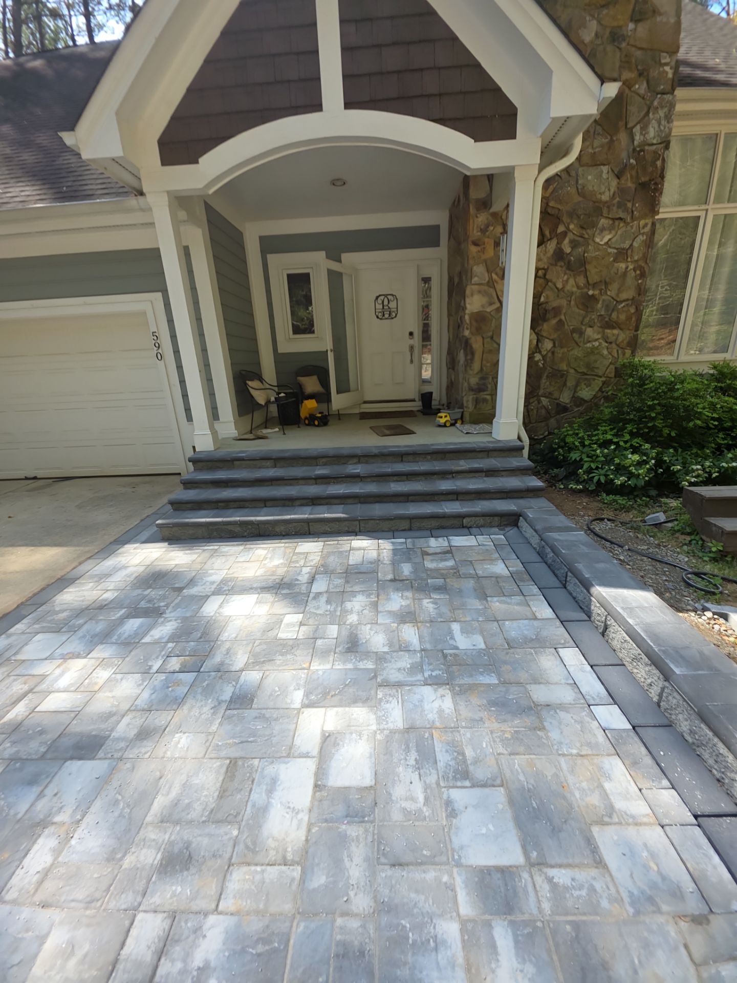 Pittsboro Outdoor Living Transformation – Retaining Wall, Paver Patio & Elevated Deck by Elite Remodeling and Design LLC