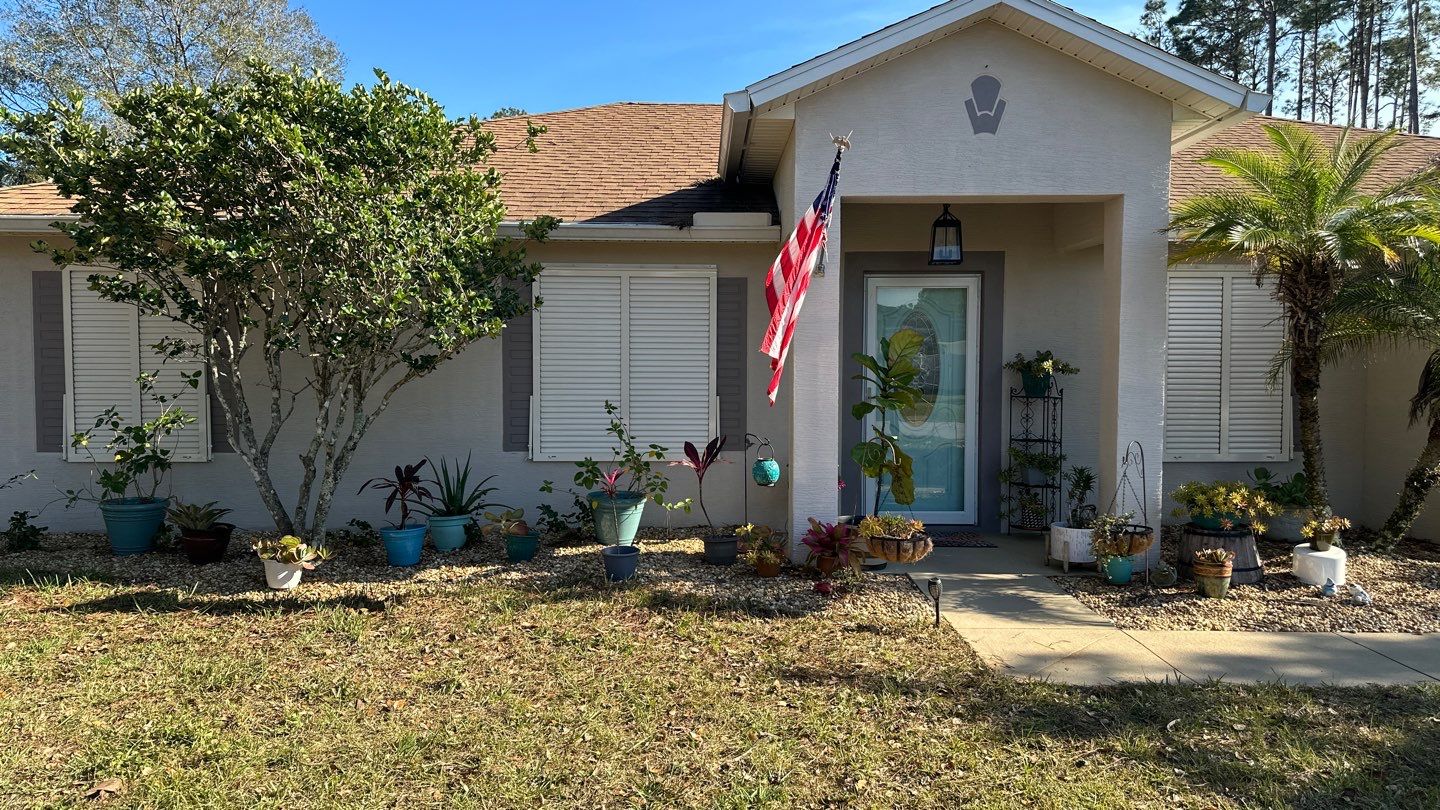 Hurricane Rated Bahama Shutters in Cream by Smart Guard Shutters