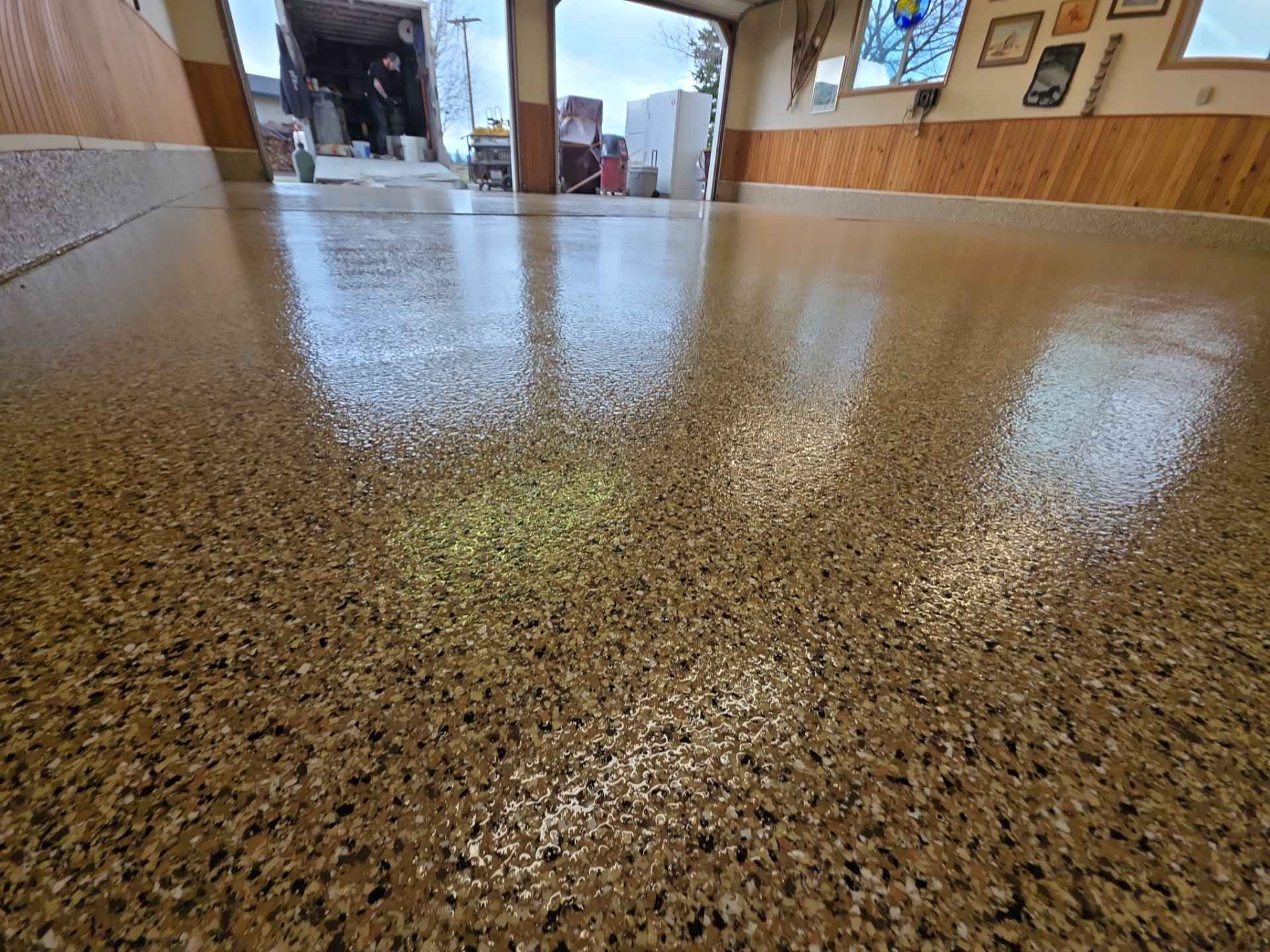 Sandstone Polyaspartic Garage Floor Coating Transformation in Davenport by Croc Coatings, LLC