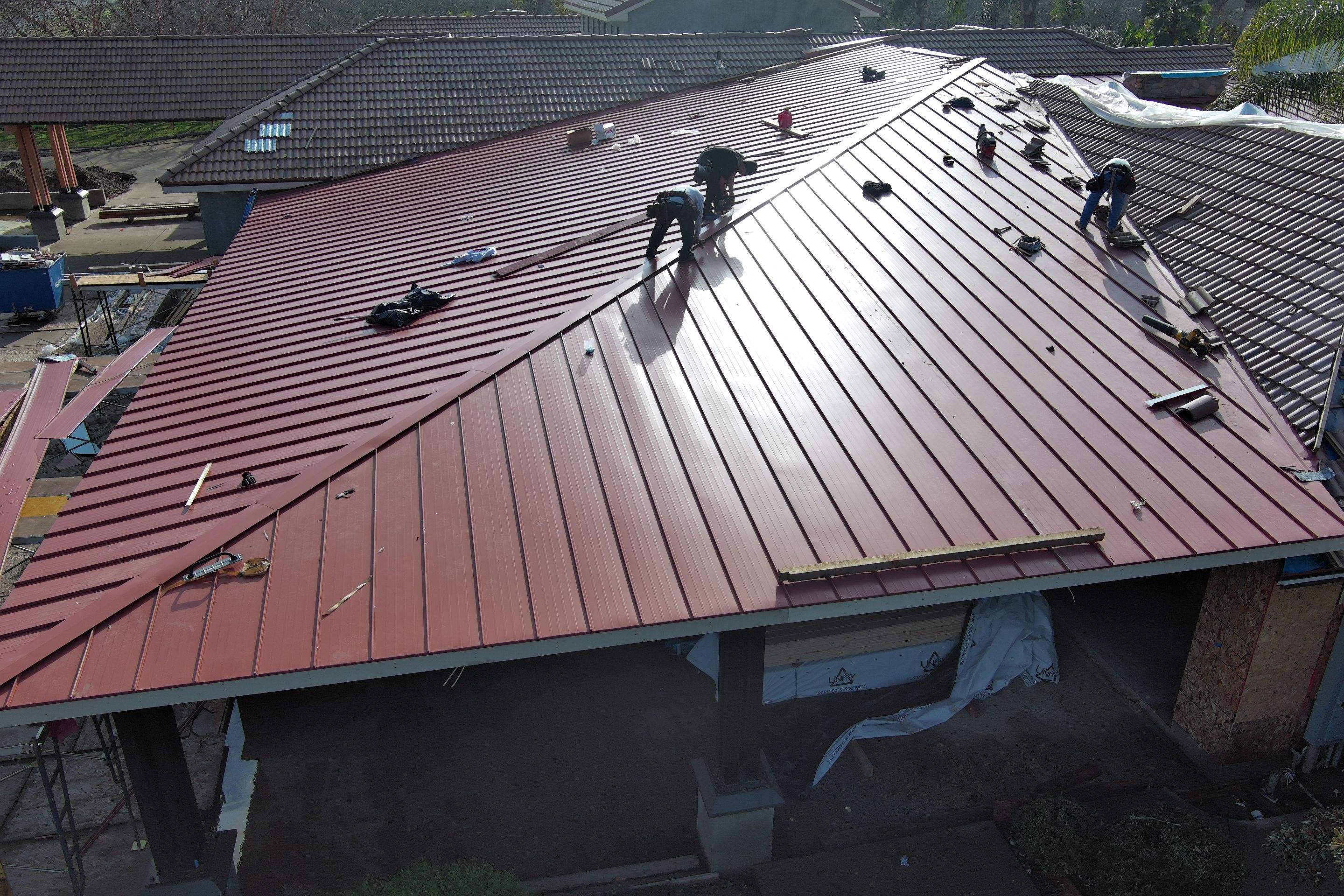 Tile, Metal, and TPO roofing project (new construction) by Straight Edge Roofing Inc