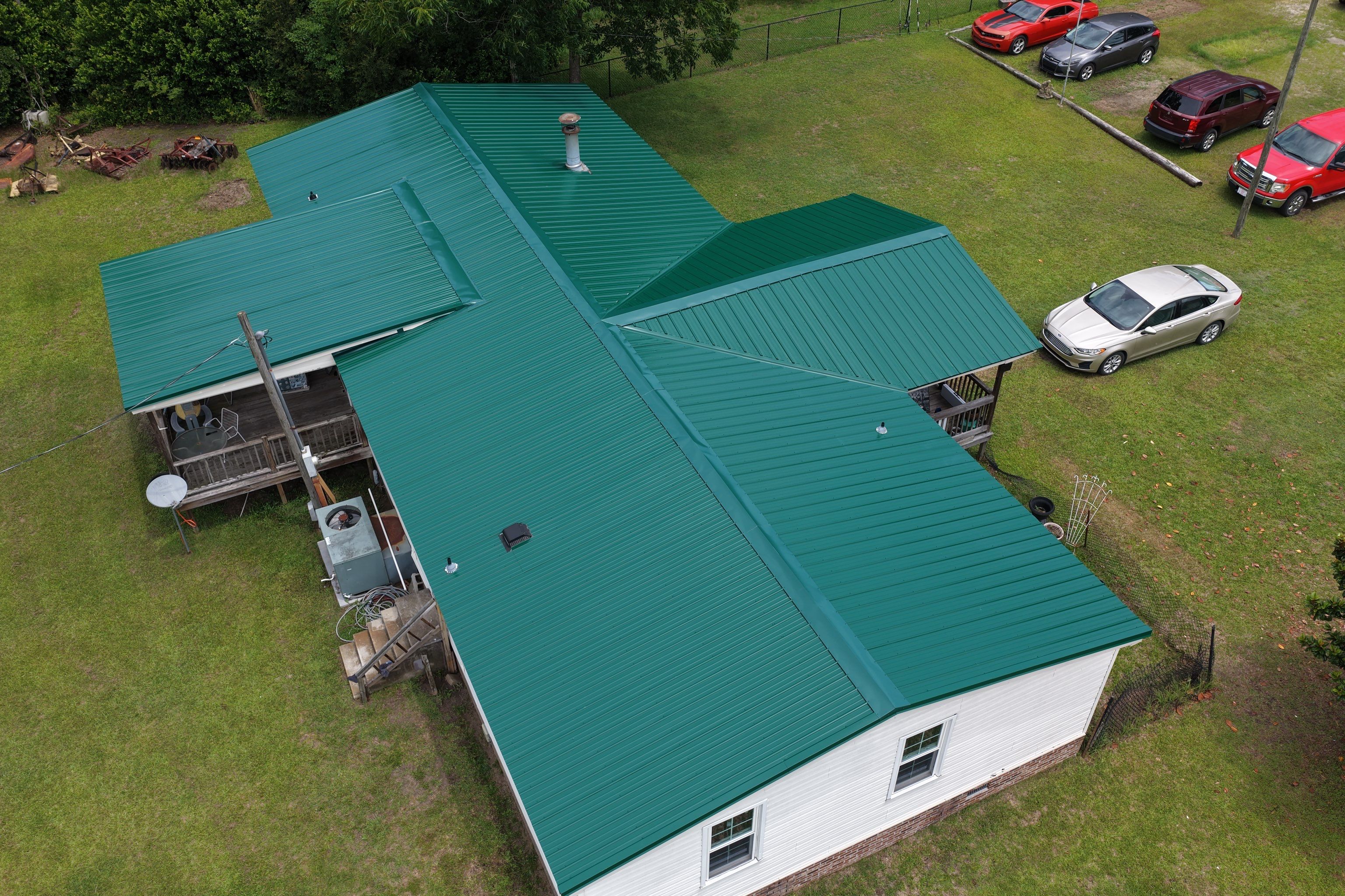 Standing Seam Green Metal Roof Installation in Sumter by Exterior Genie, LLC
