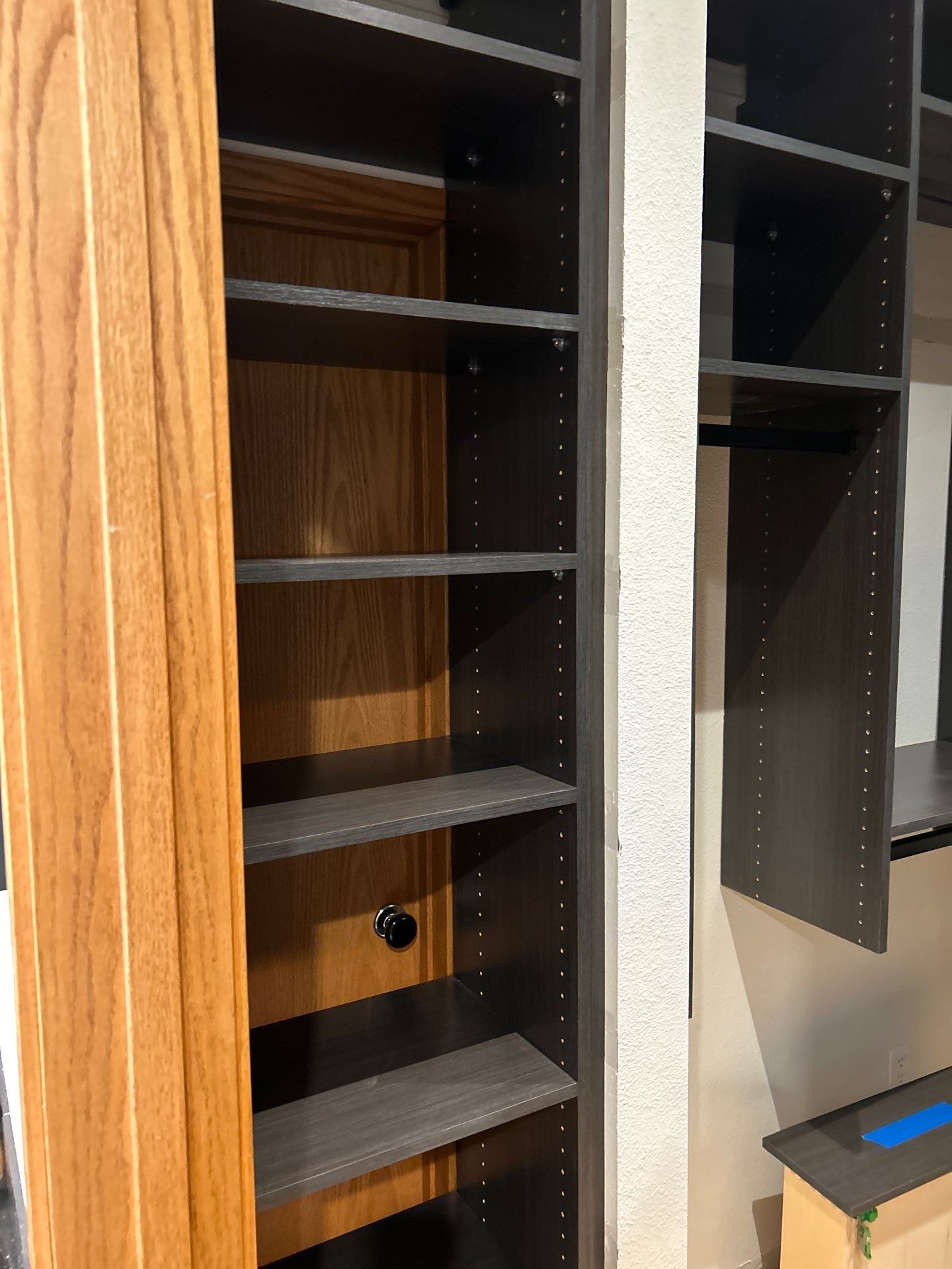 Black Riftwood Primary Closet in Centennial by Concept 32, Inc.
