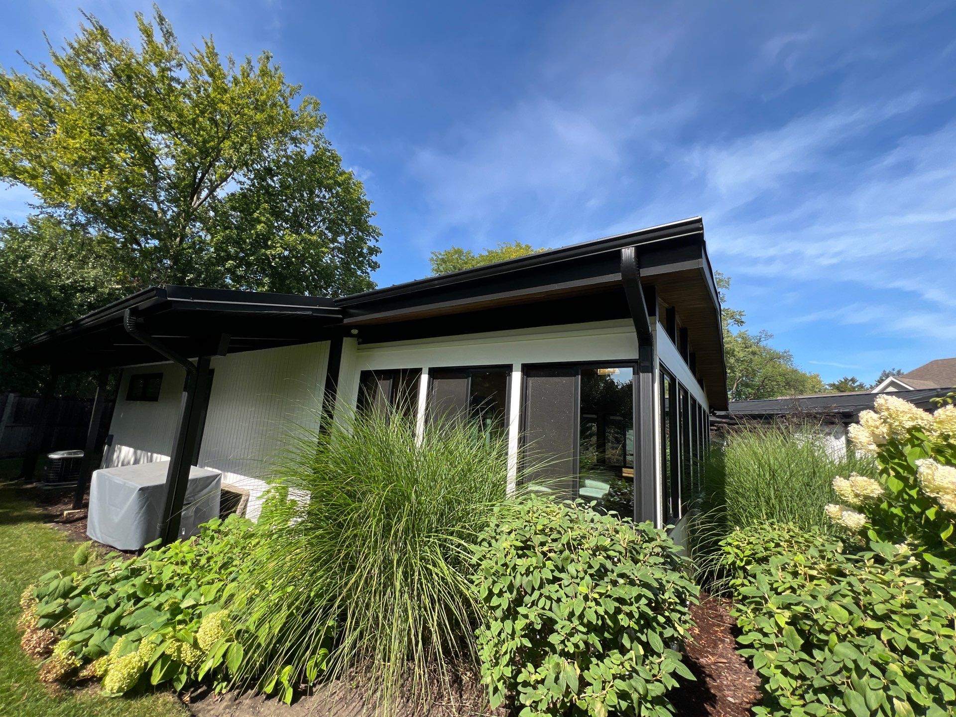 Complete Exterior House, Bluestone & Garage Floor Cleaning by Northern Power Washing LLC.