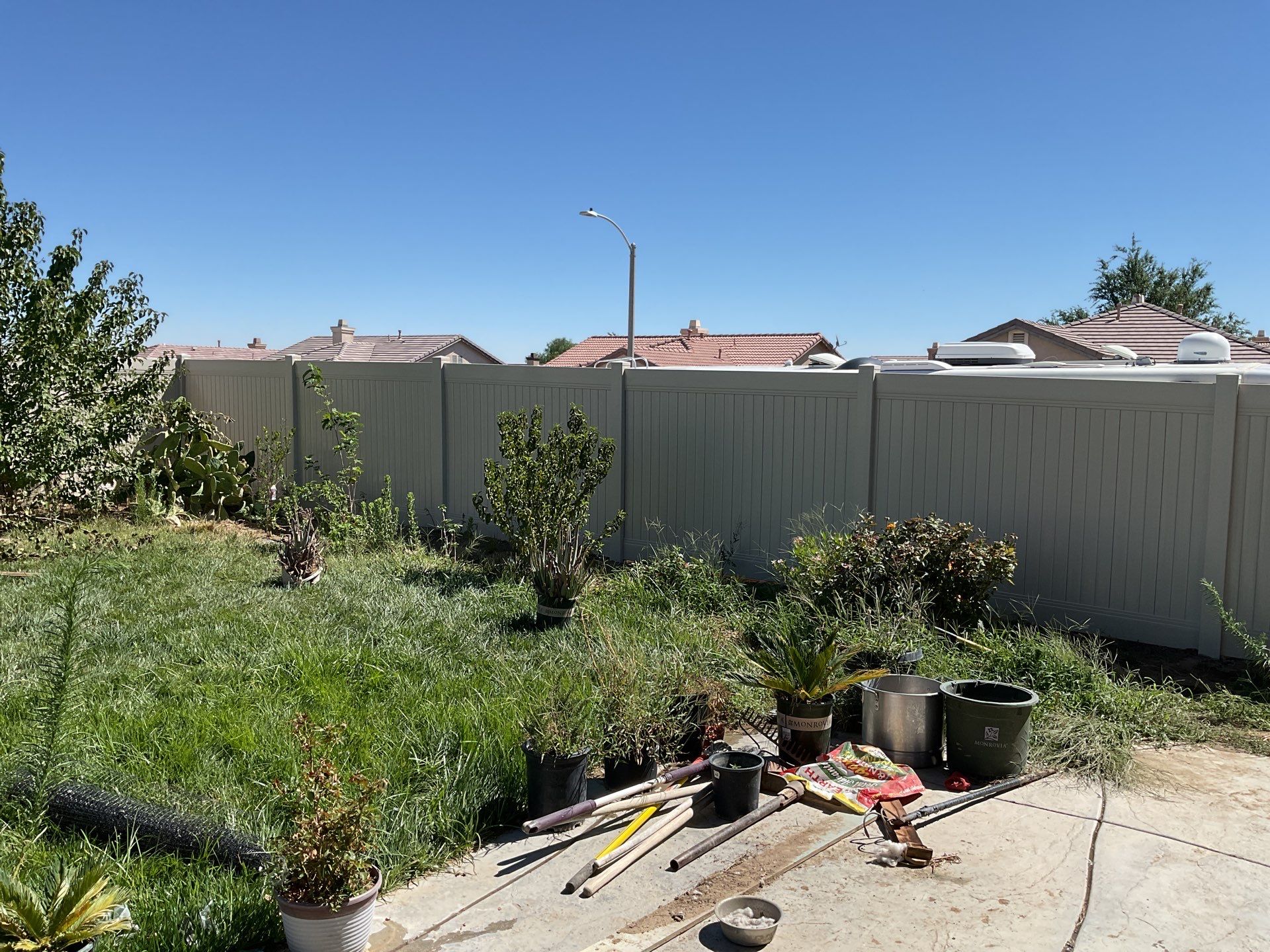 Tan Vinyl by Fence Guys Inc. 