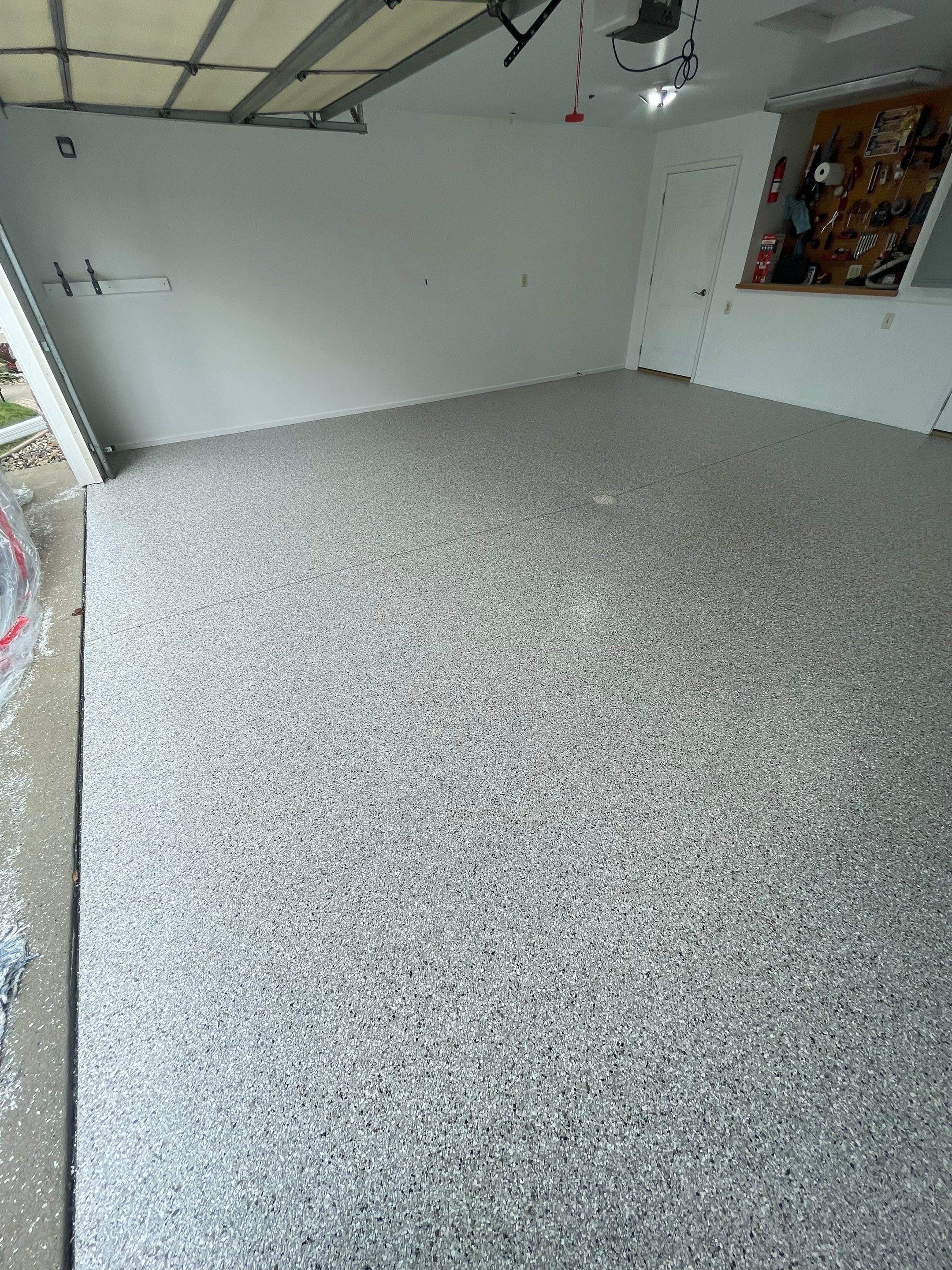Coyote Flake Garage Floor Coating in Worthington, Minnesota by Select Painting, Coatings & Garage Cabinets