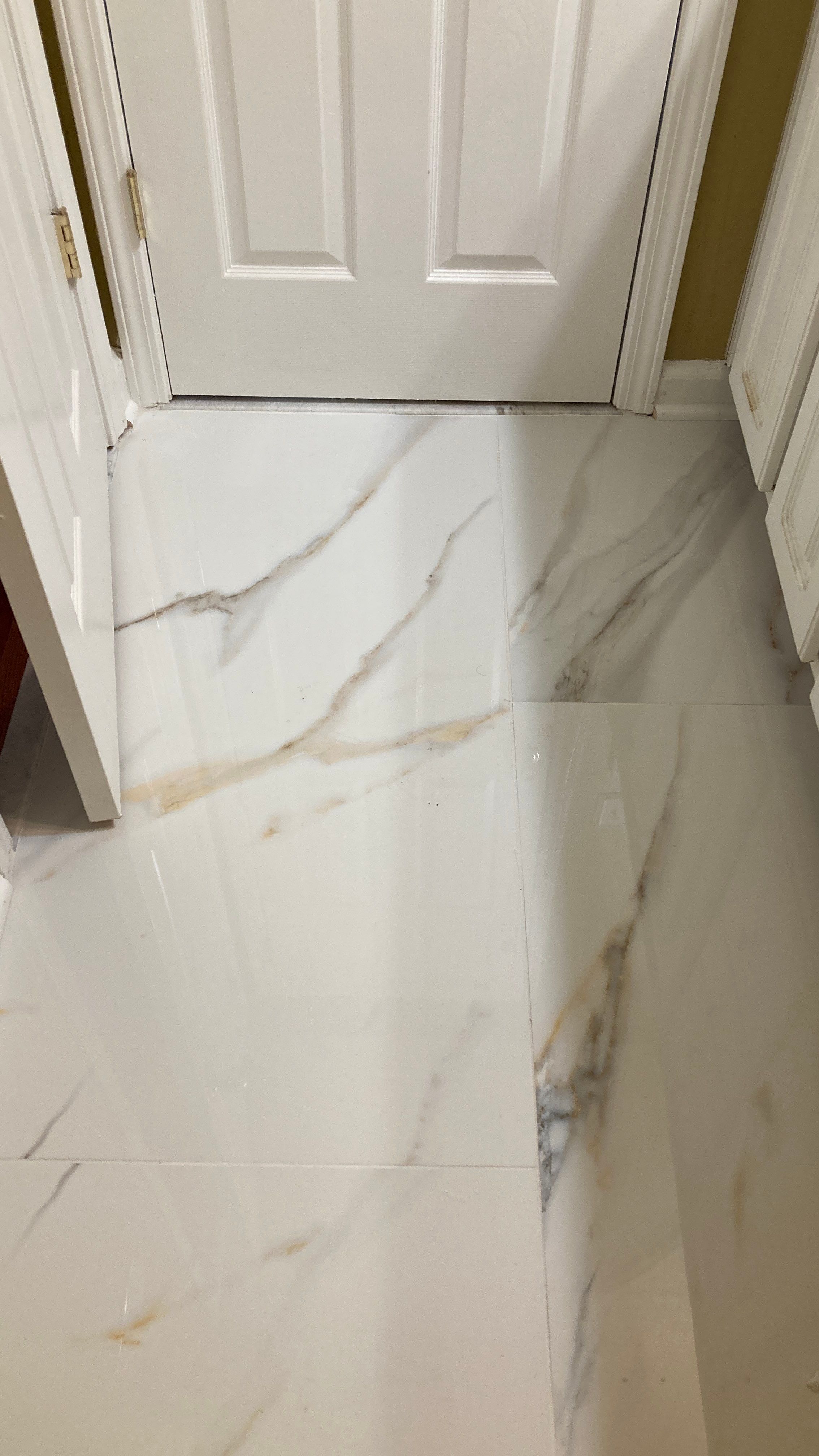 Lovely marbled bathroom floor  by Footprints Floors of Nashville