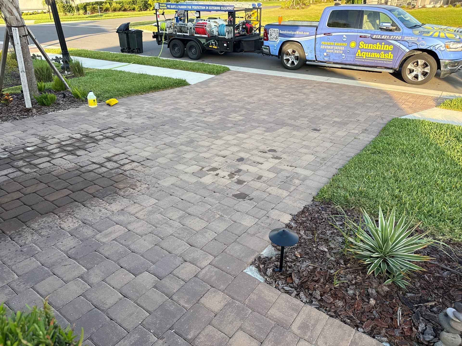 Oil Stain Removal on Paver Driveway | Esplanade at Artisan Lakes, Palmetto FL by Sunshine AquaWash