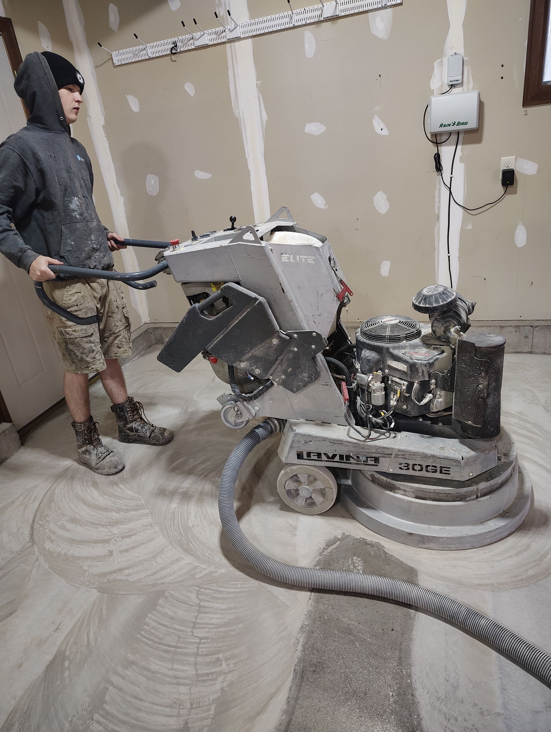 Multi-Car Garage Concrete Coating and Epoxy Finish in Sioux Falls by Select Painting, Coatings & Garage Cabinets