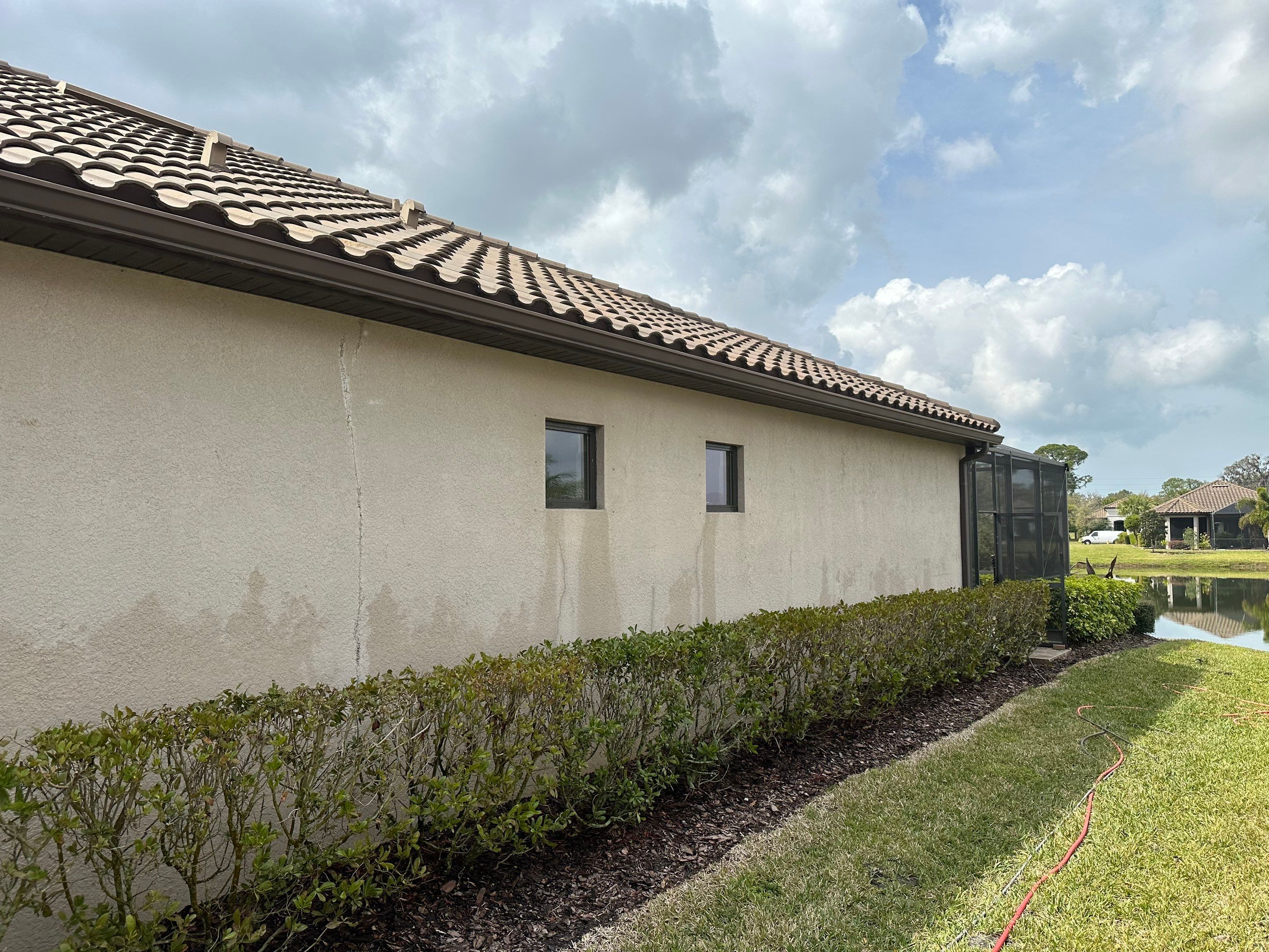 Concrete Tile Roof, Paver Pool Deck, Screen Enclosure & Driveway Cleaning in Artisan Lakes Esplanade, Palmetto, FL | Sunshine AquaWash by Sunshine AquaWash
