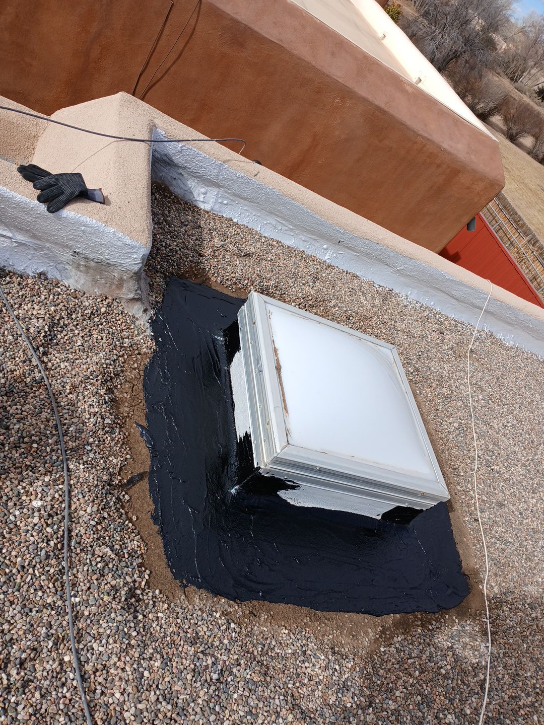 Roof Maintenance and Low-E Tempered Glass Skylight Replacement on Gravel Roof in Northwest Albuquerque by Doyle Roof Masters Inc