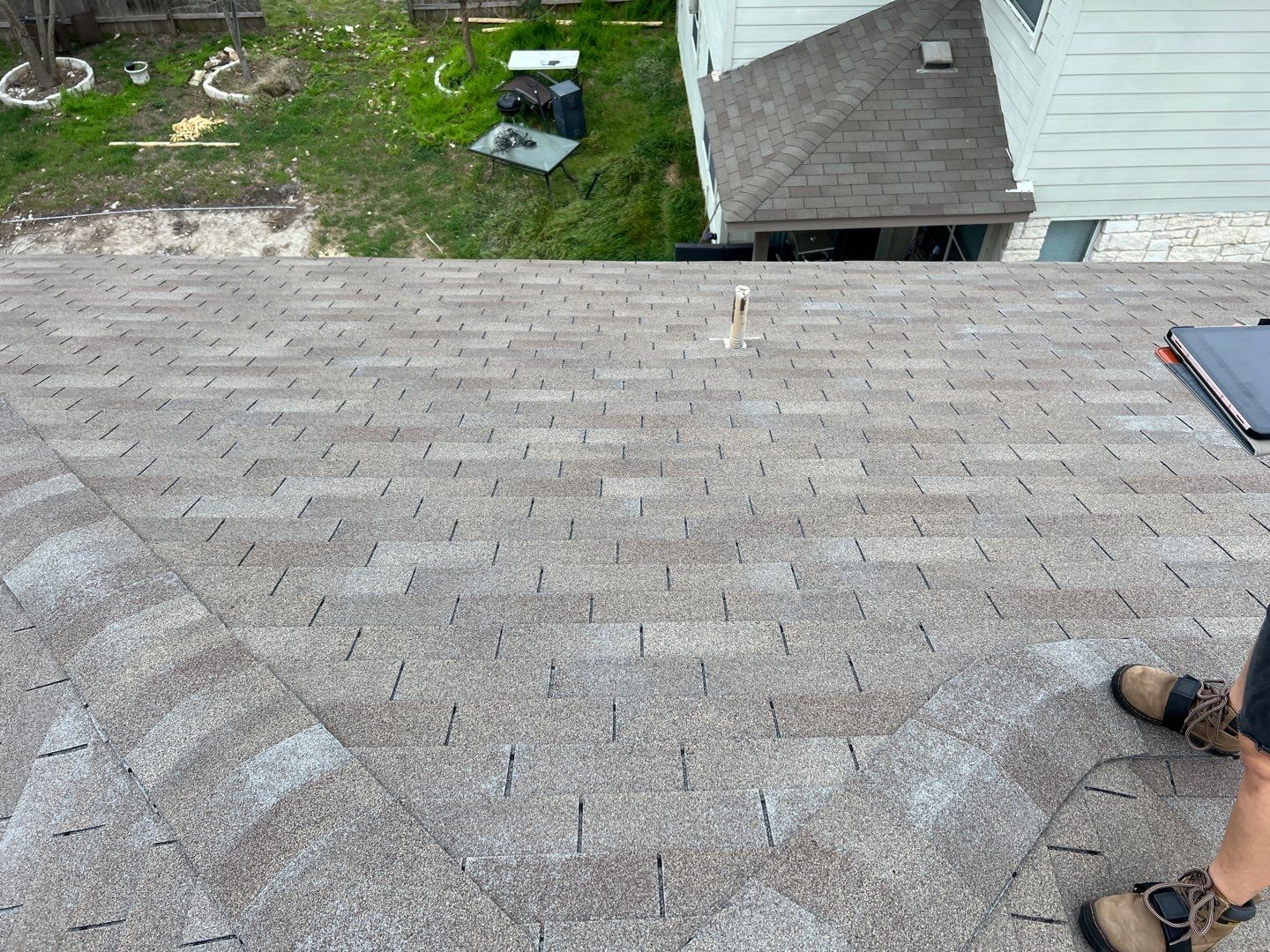 Wind damaged roof replacement by Oakwood Roofing and Construction, LLC