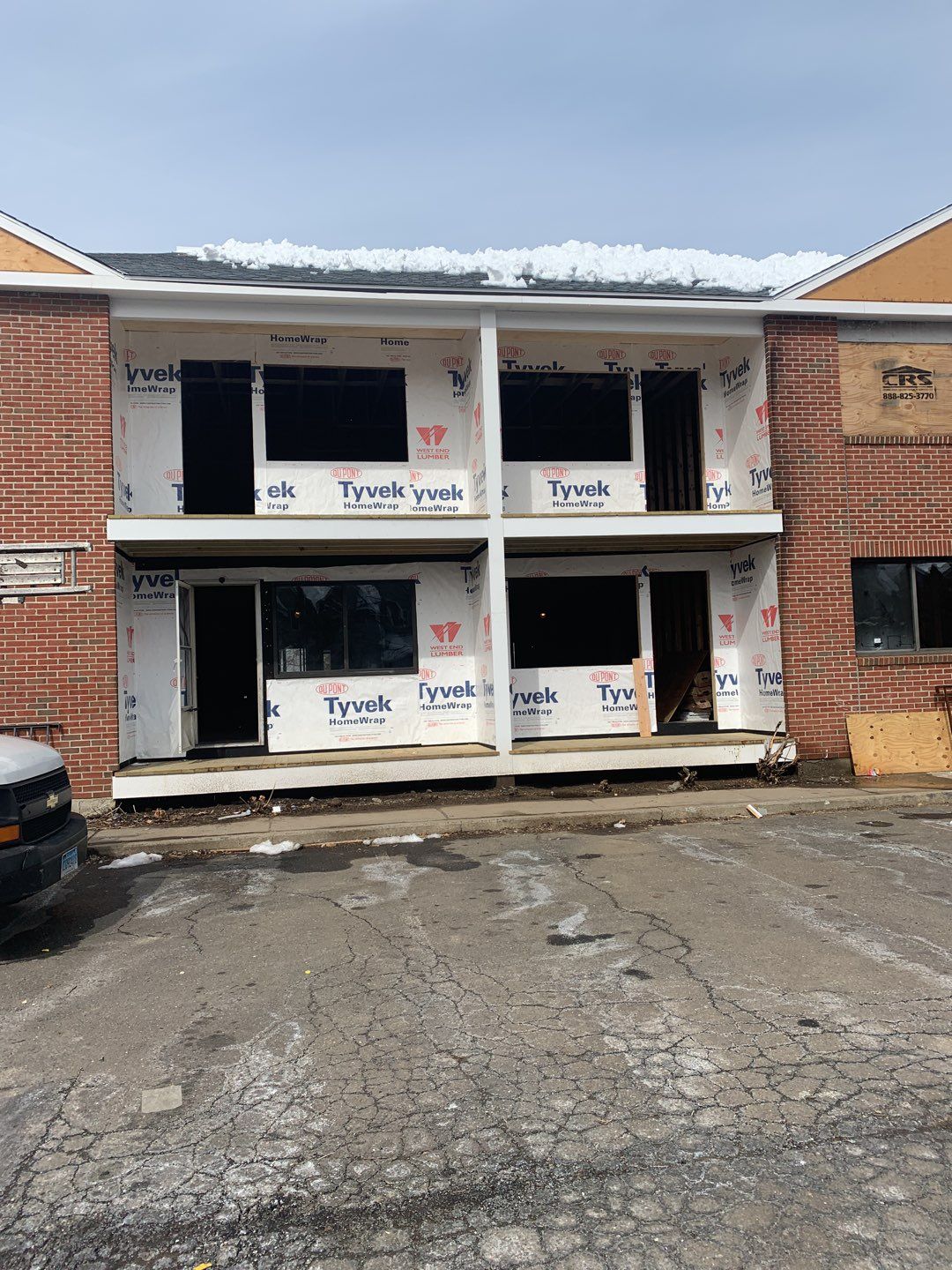 Commercial Roofing Installation using EPDM with white gutters by A Plus Exterior