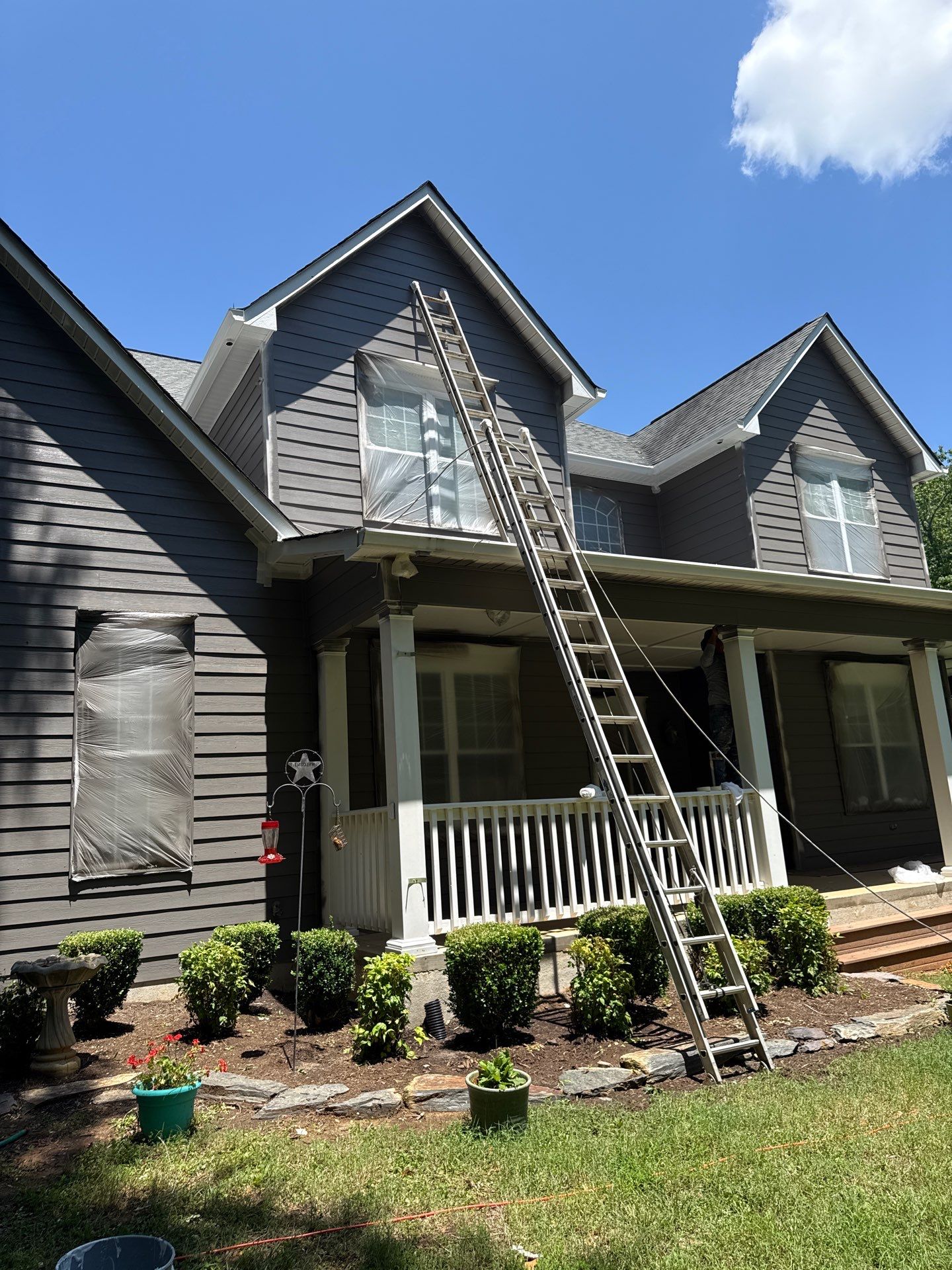 Siding replacement, exterior painting, and front door staining. by GonzalezPainters & Contractors Inc