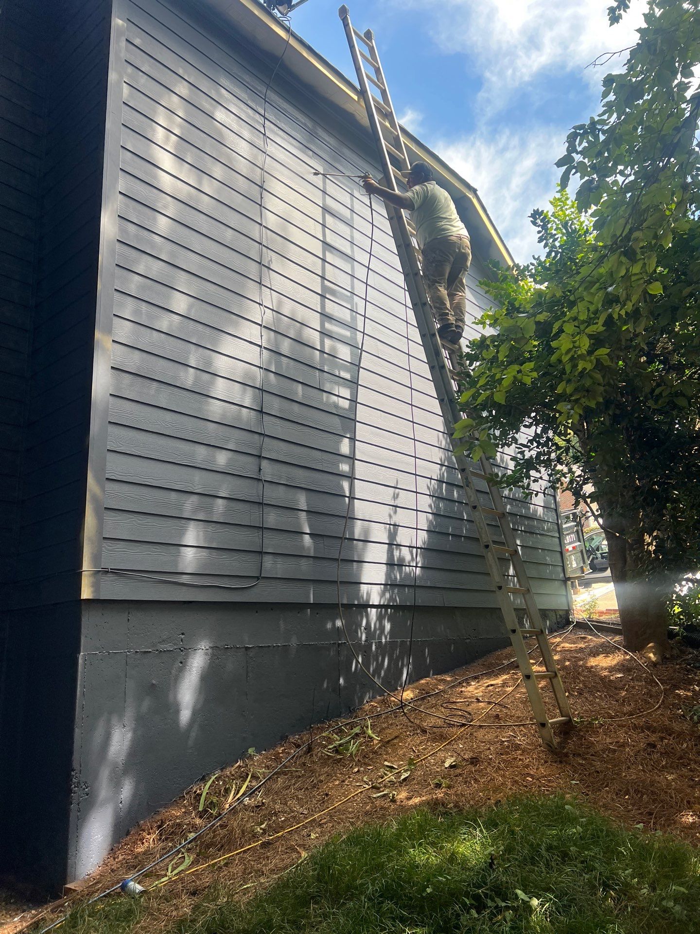 Blue Exterior Paint and Siding Installation using James Hardie Lap Siding by Nelson Exteriors