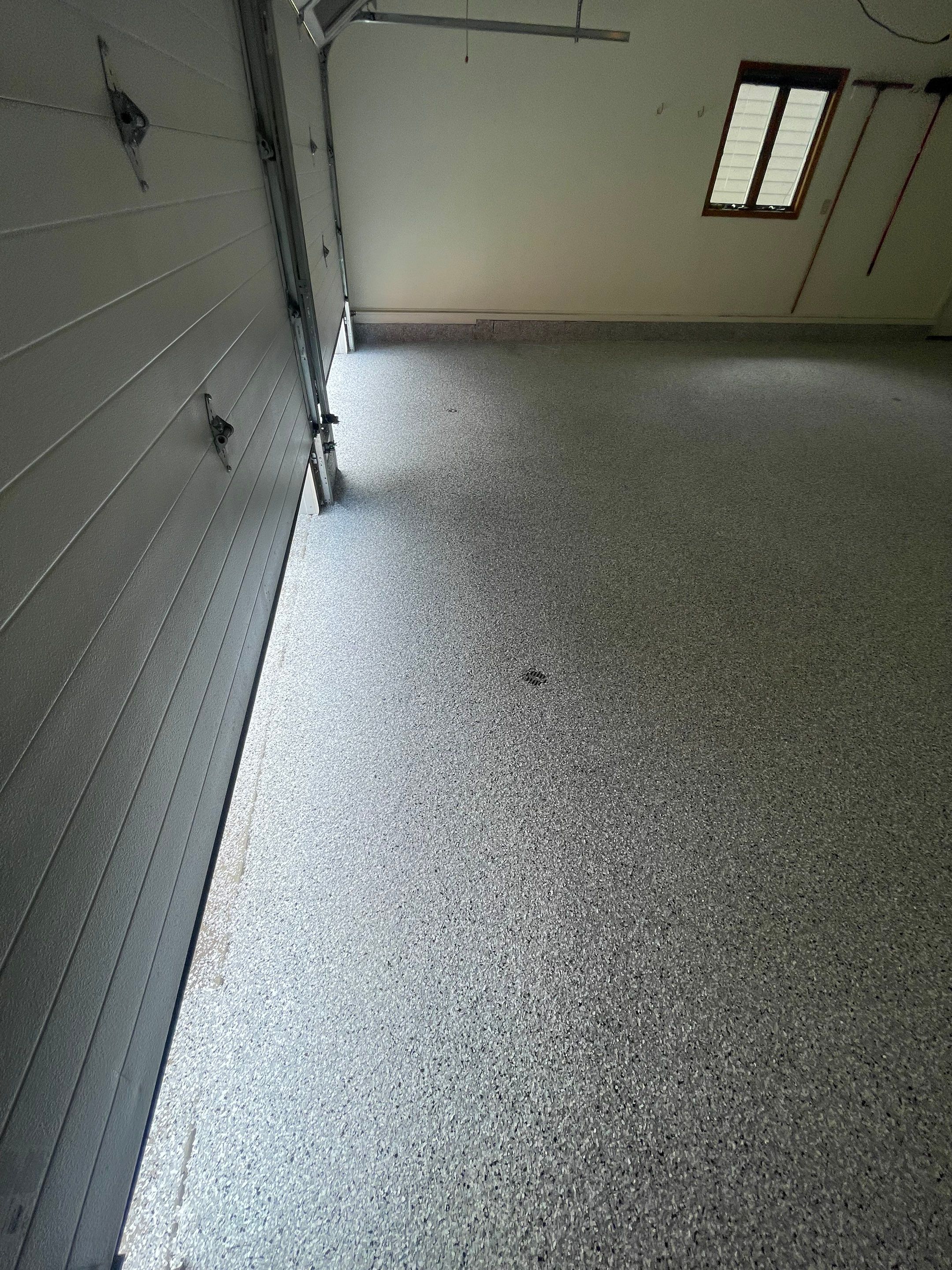 Madison Garage Concrete Coating with Feather Grey Speckle Finish by Select Painting, Coatings & Garage Cabinets