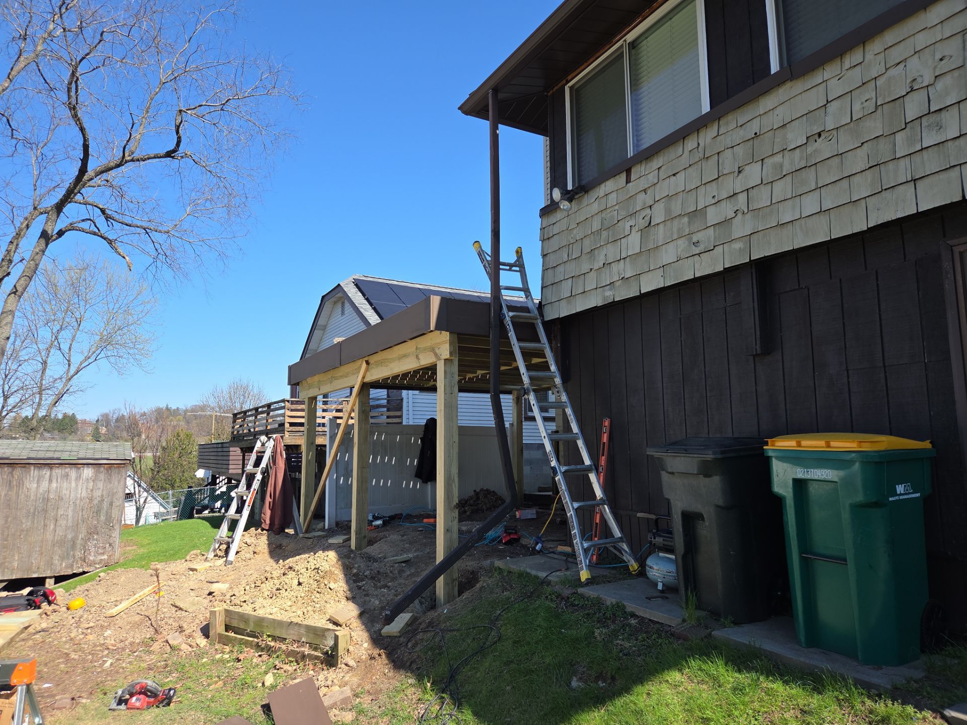 Custom Composite Deck and Wood-Plank Stamped Concrete Patio in Pittsburgh by Cousins Roofing Siding & Decks